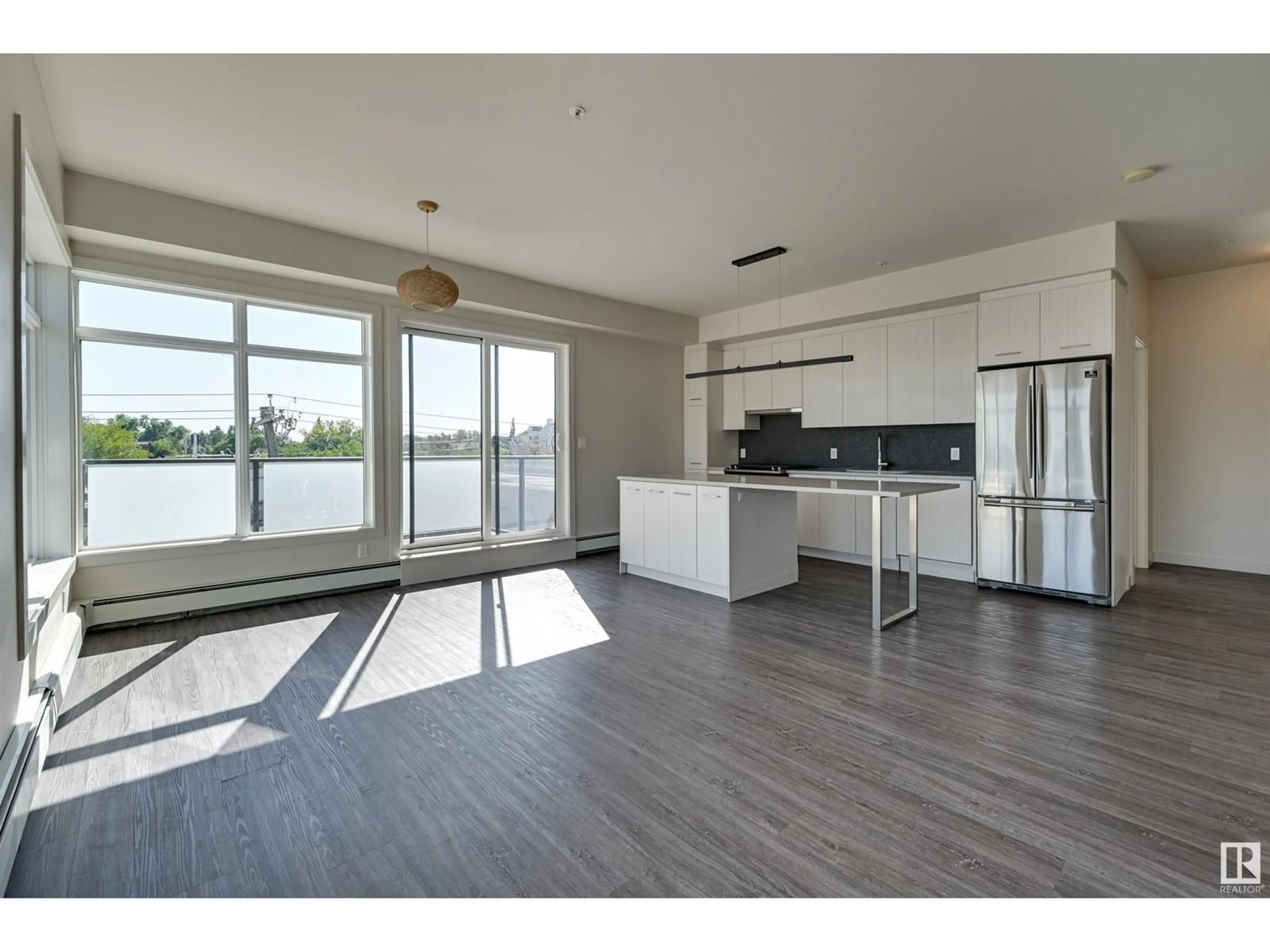 Open concept kitchen, wood/laminate floor for #403 10837 83 AV NW, Edmonton Alberta T6E2E6