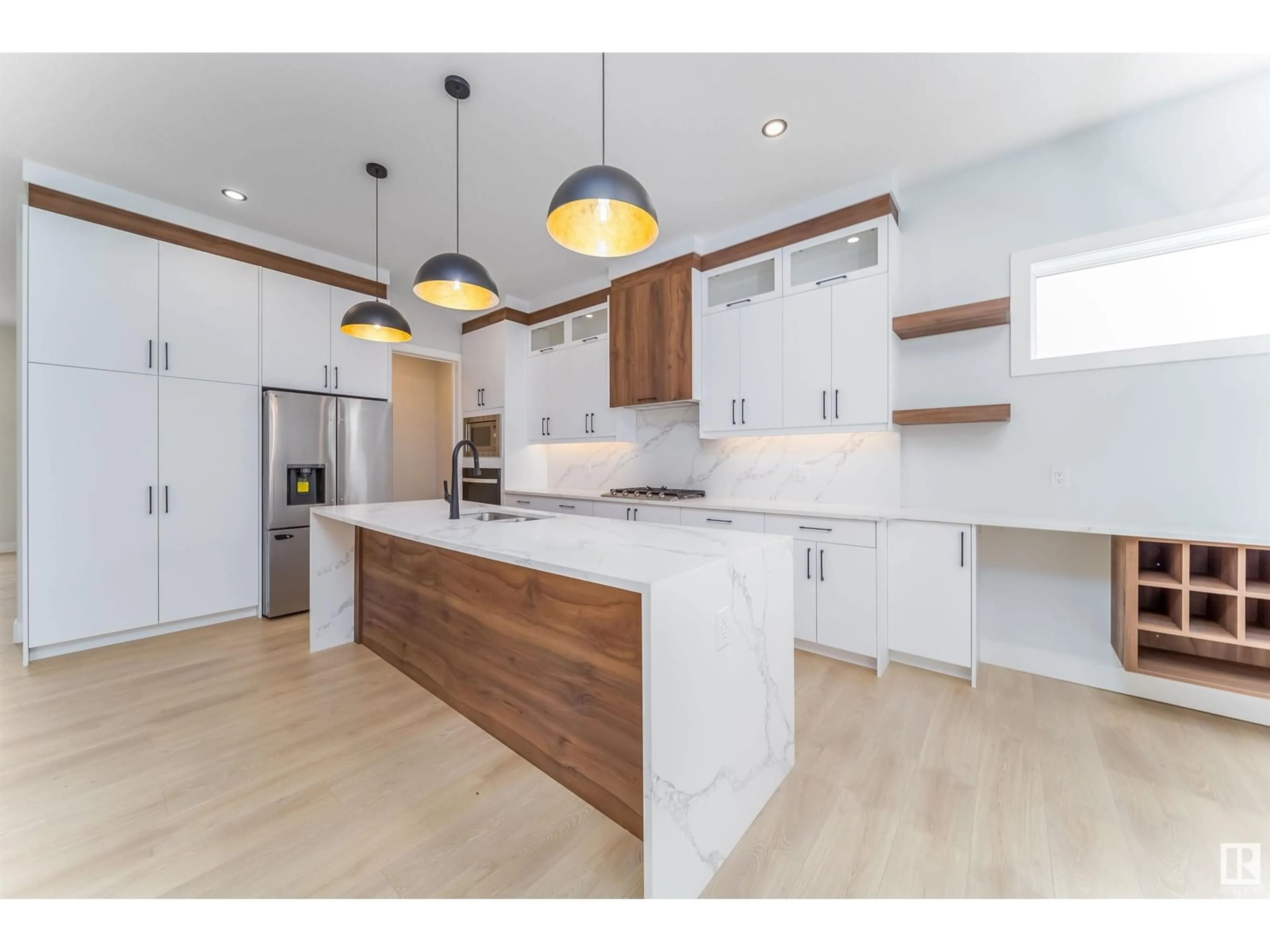 Open concept kitchen, wood/laminate floor for 6728 CRAWFORD WY, Edmonton Alberta T9G0B7