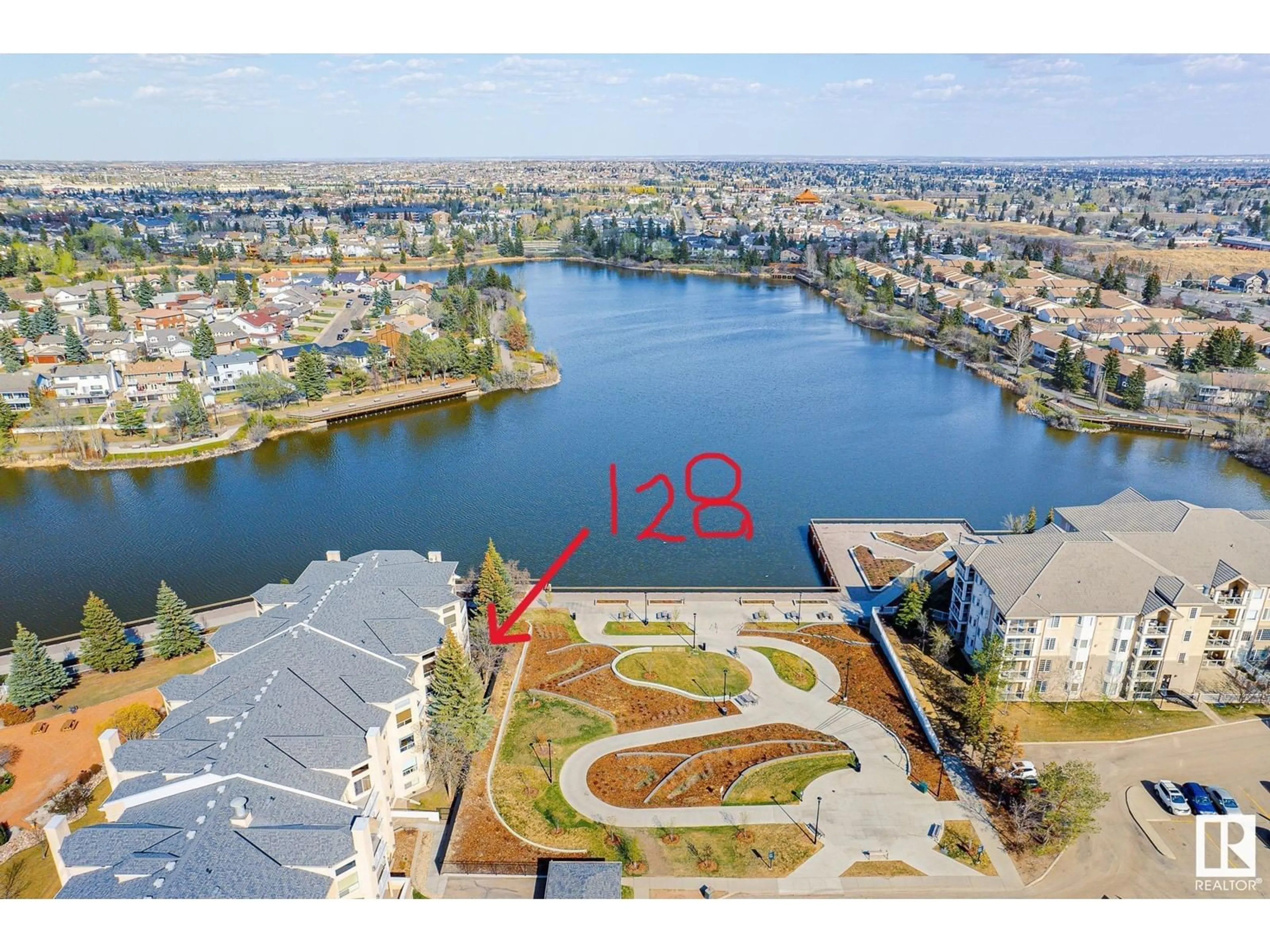 A pic from outside/outdoor area/front of a property/back of a property/a pic from drone, water/lake/river/ocean view for #128 15499 CASTLE DOWNS RD NW, Edmonton Alberta T5K5Y3