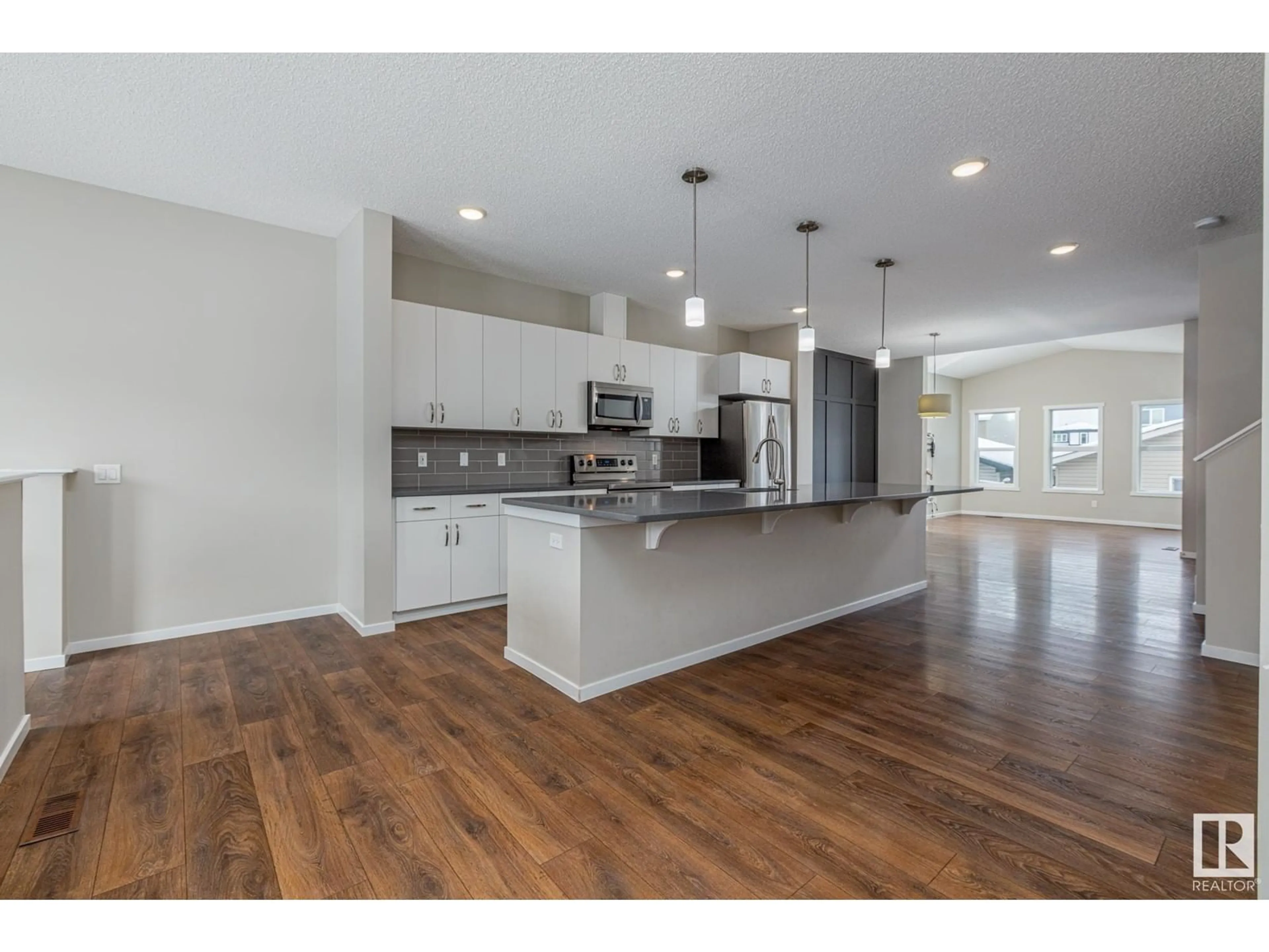 Open concept kitchen, wood/laminate floor for 2587 COUGHLAN RD SW, Edmonton Alberta T6W3S1