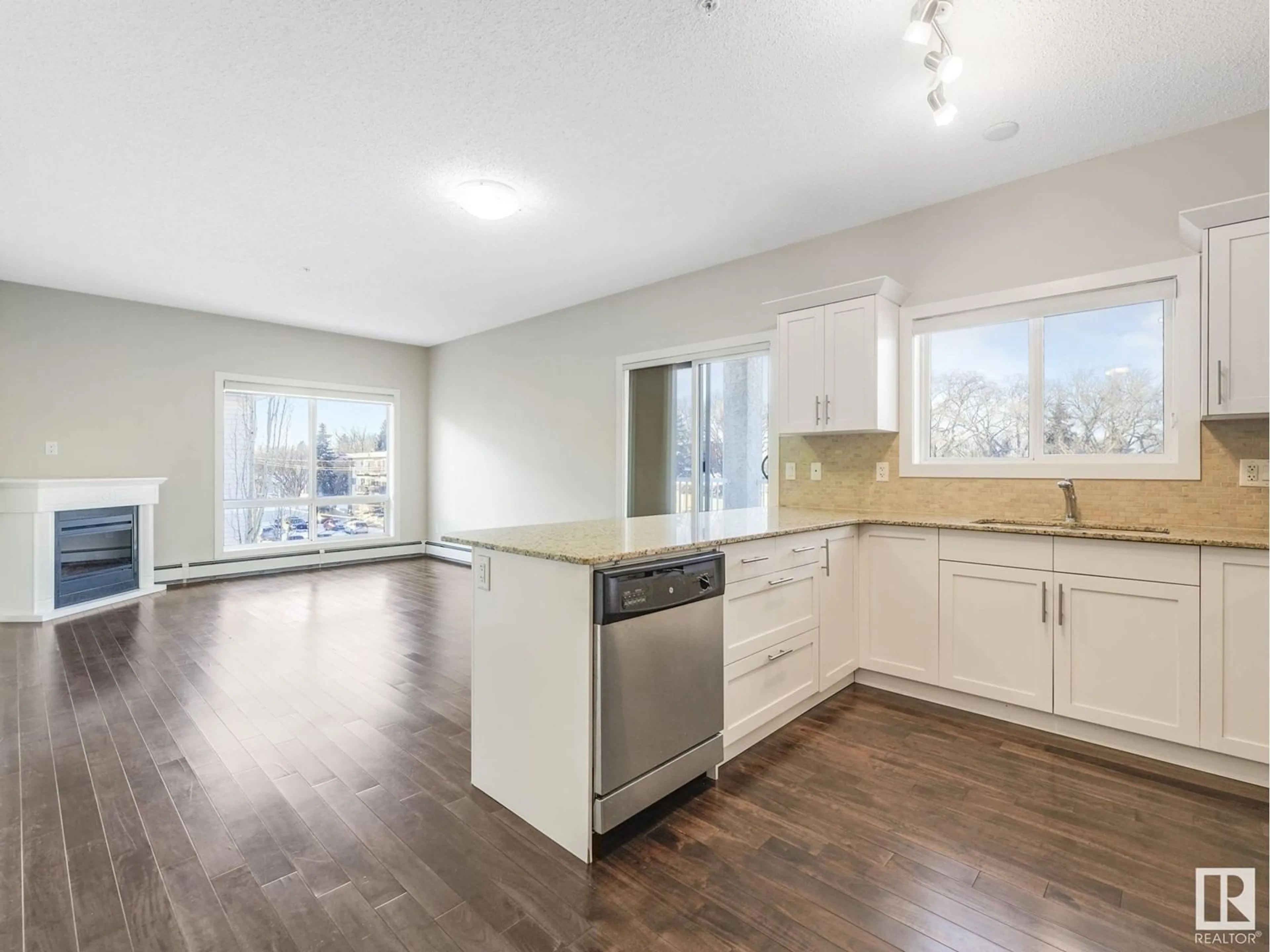 Open concept kitchen, wood/laminate floor for #304 - 10524 77 AV, Edmonton Alberta T6E1N1