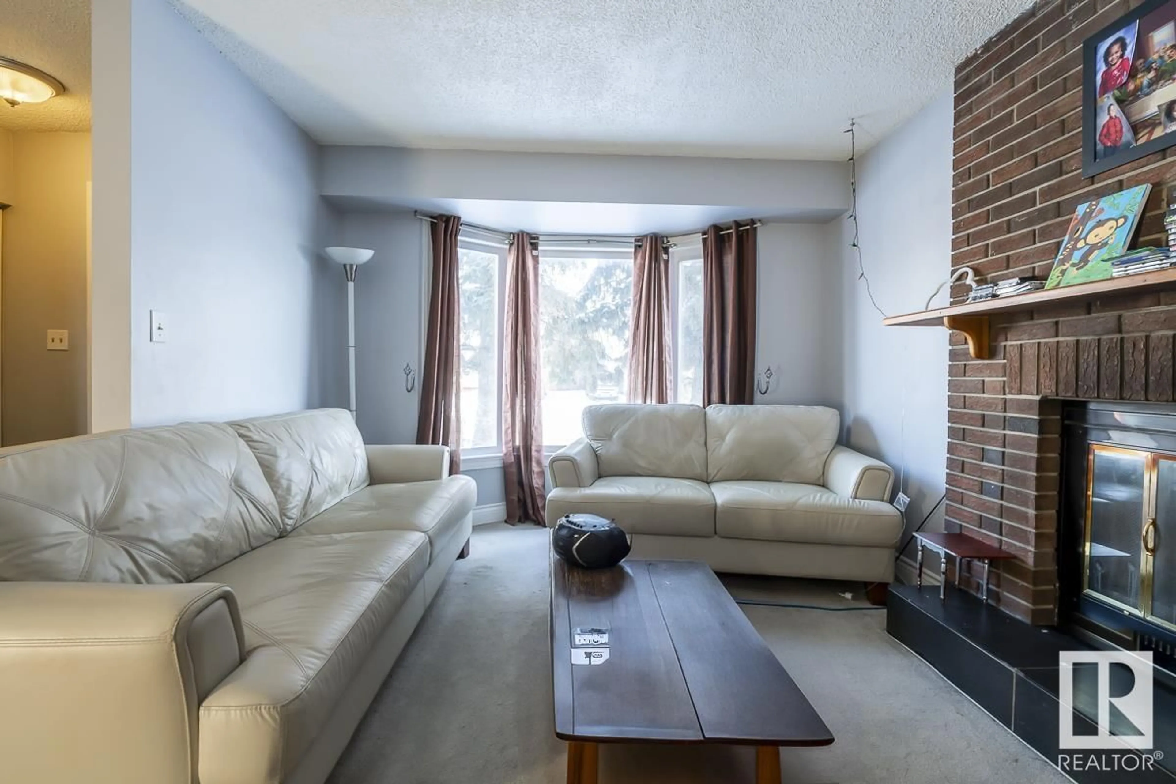 Living room with furniture, unknown for 4571 32 AV NW, Edmonton Alberta T6L5J4