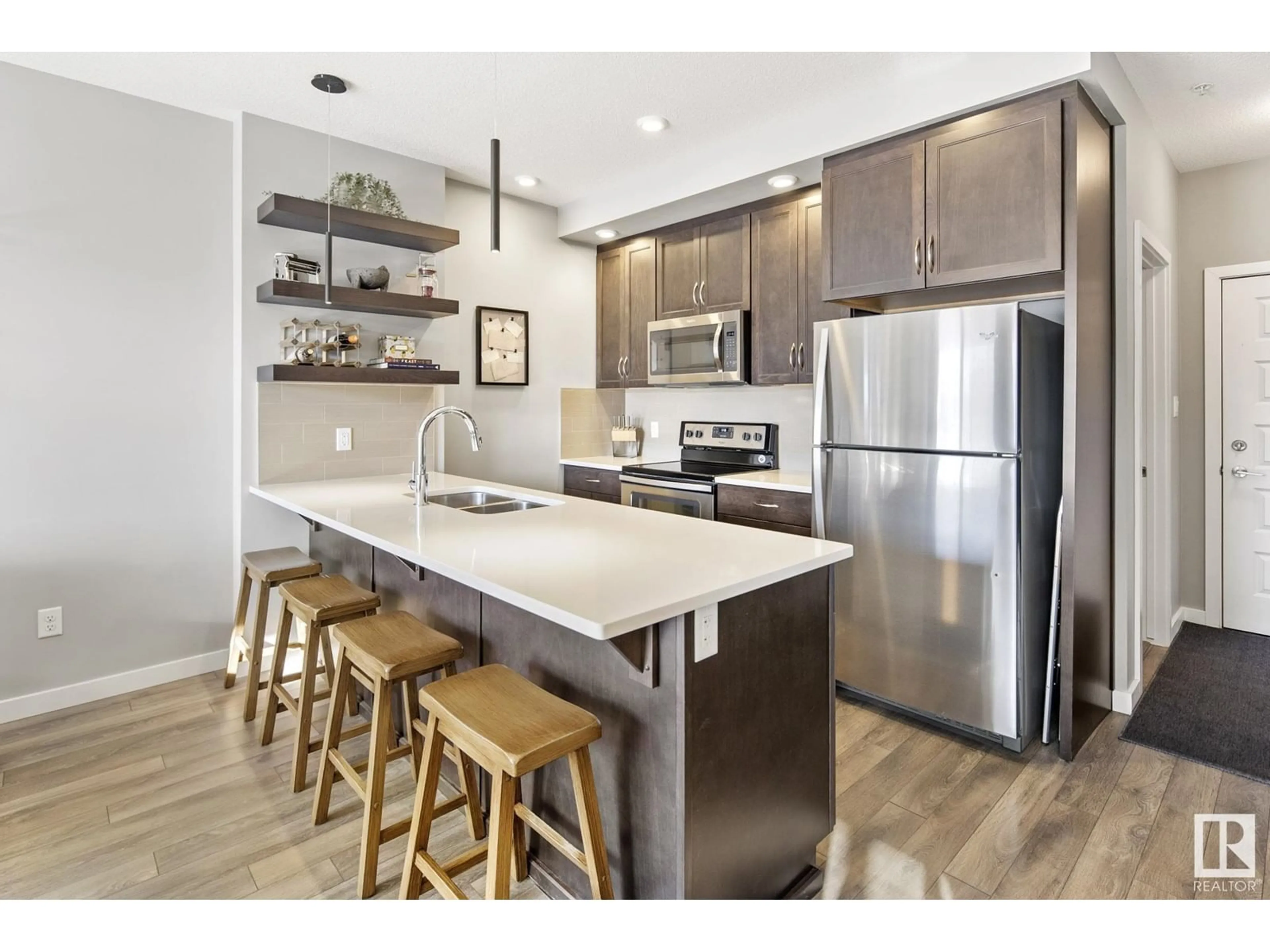 Open concept kitchen, unknown for #138 1008 ROSENTHAL BV NW, Edmonton Alberta T5T7J4