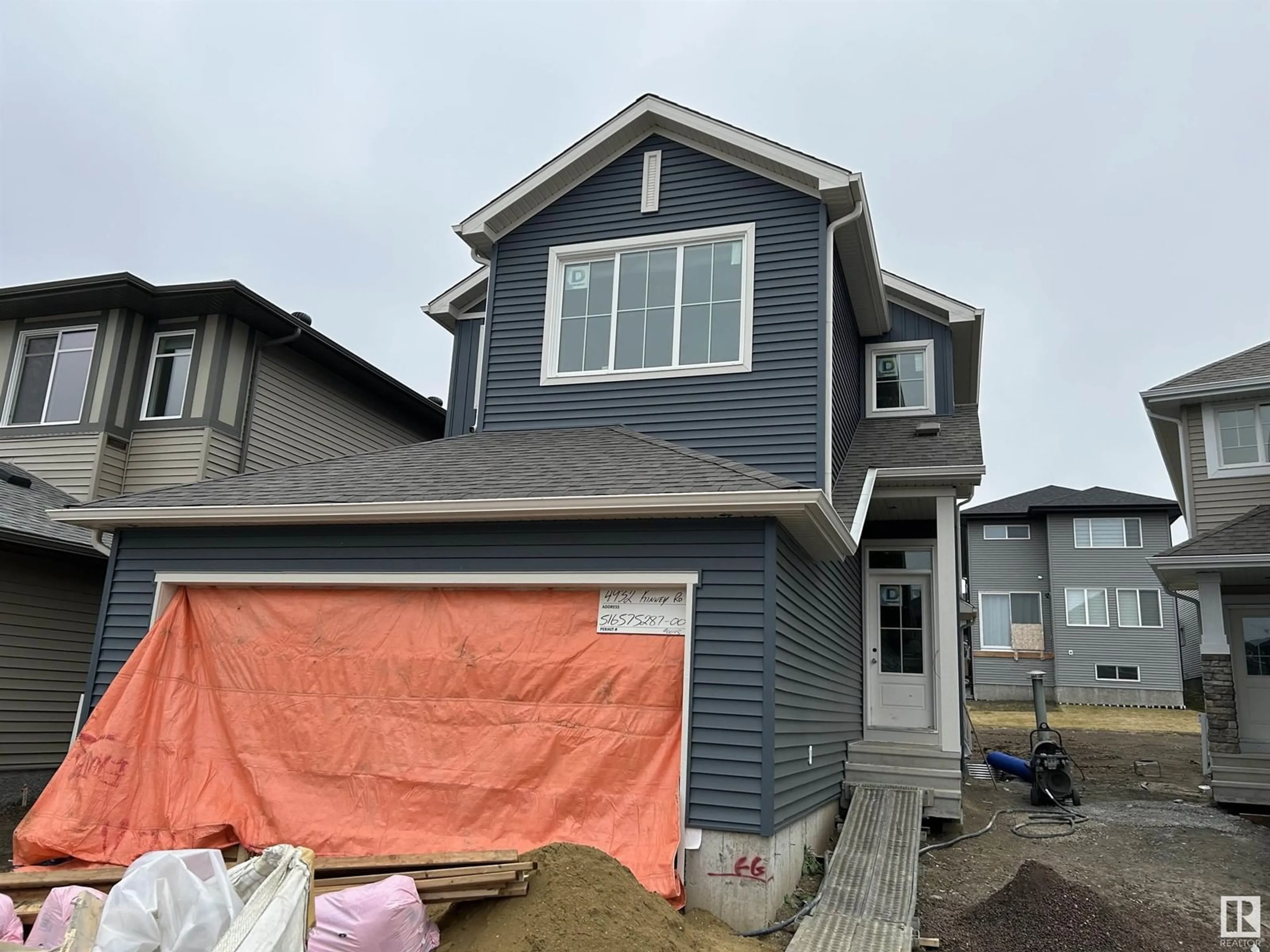 Home with vinyl exterior material, street for 4932 KINNEY RD SW, Edmonton Alberta T6W5G9