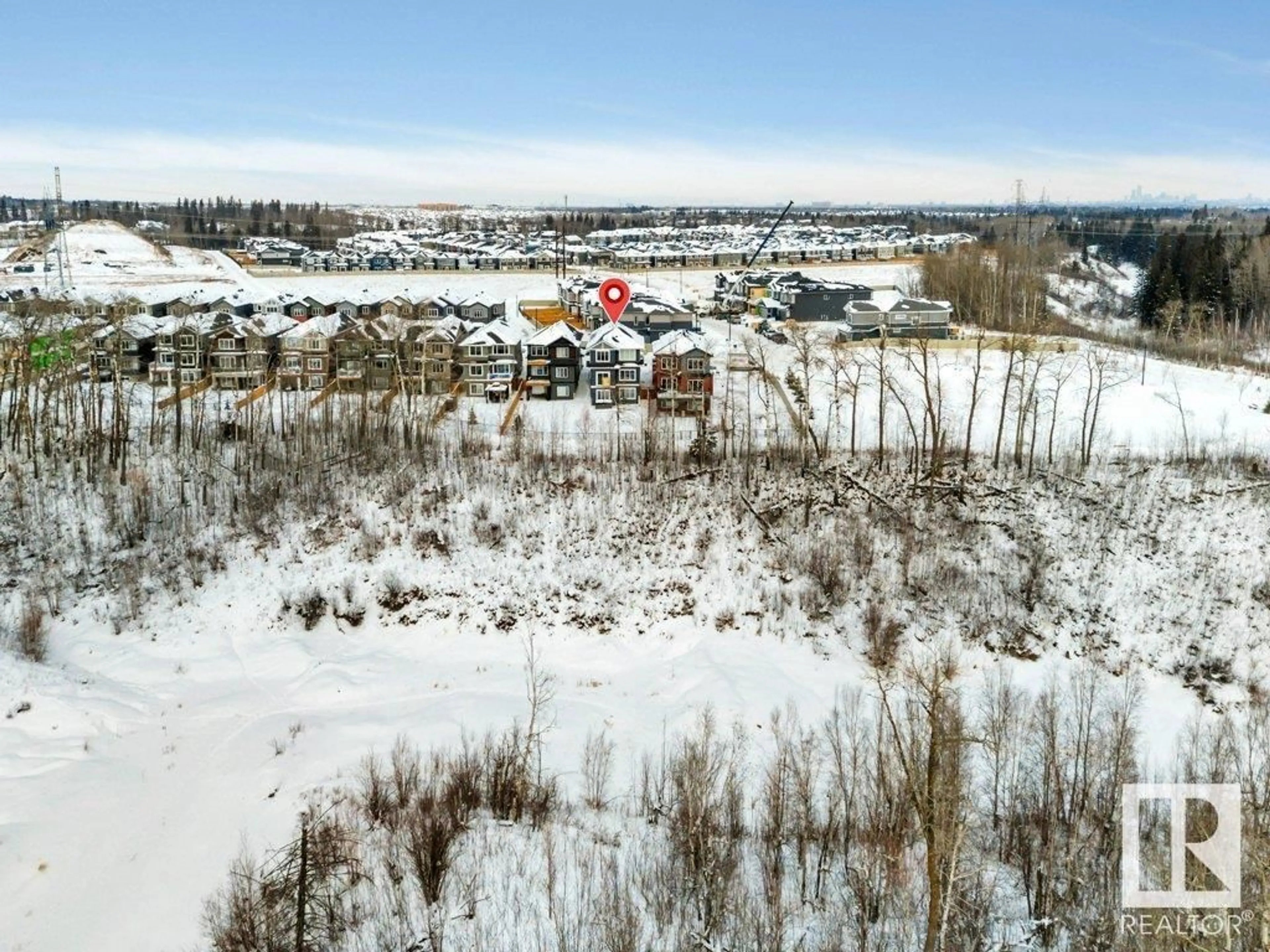 A pic from outside/outdoor area/front of a property/back of a property/a pic from drone, mountain view for 1557 ESAIW PL NW, Edmonton Alberta T6M0E5