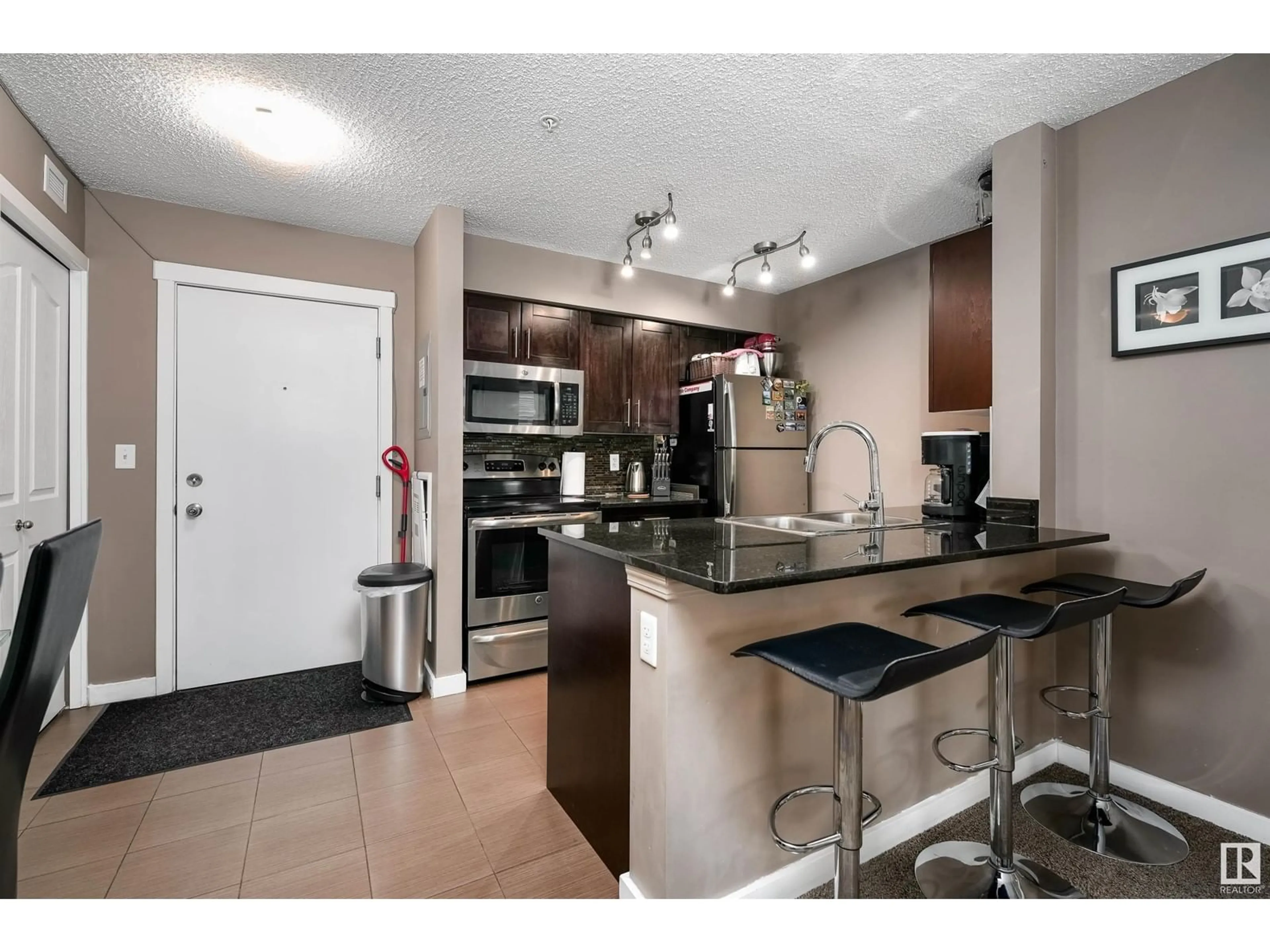 Open concept kitchen, unknown for #106 12025 22 AV SW, Edmonton Alberta T6W2Y1