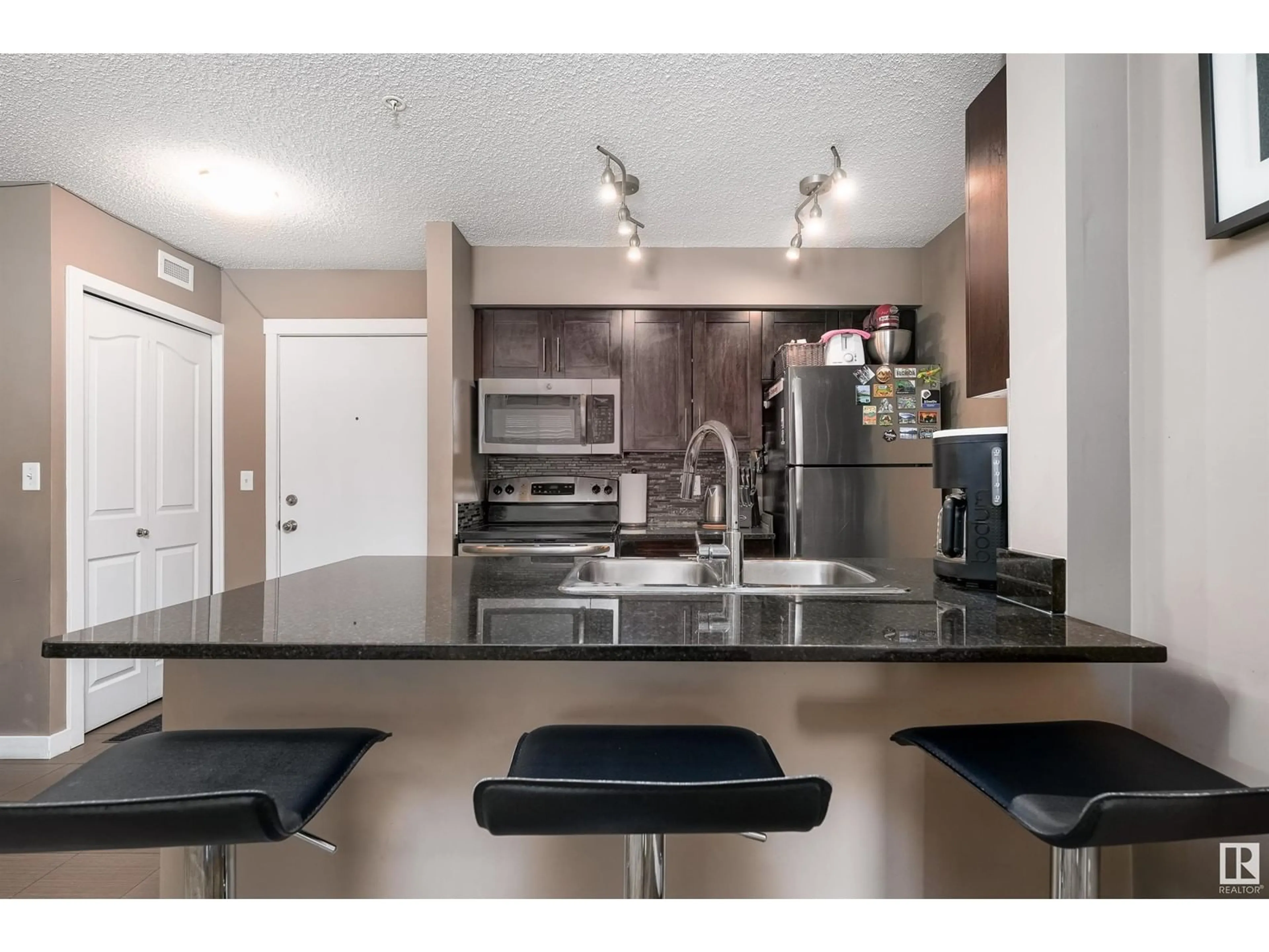 Open concept kitchen, unknown for #106 12025 22 AV SW, Edmonton Alberta T6W2Y1