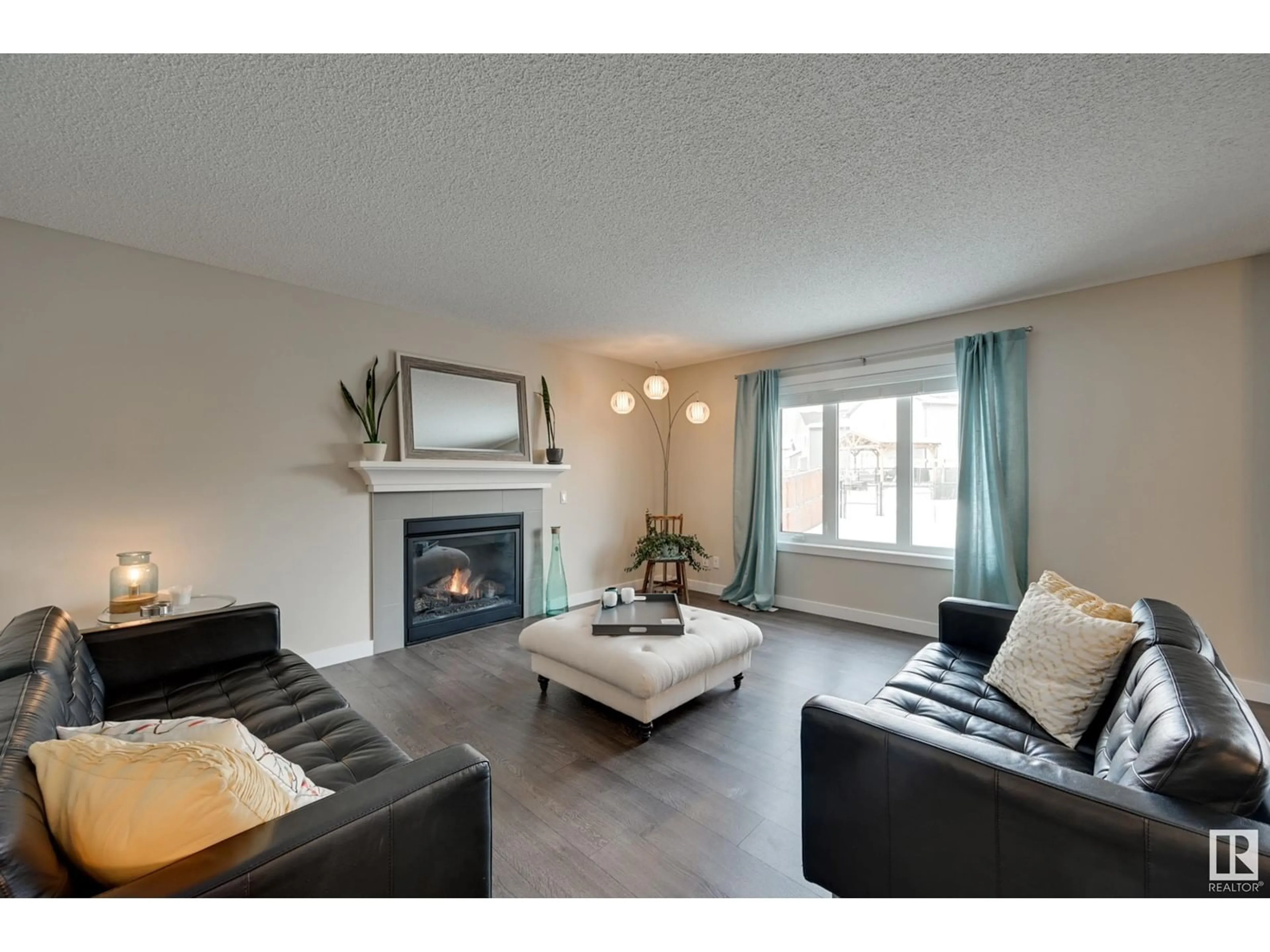 Living room with furniture, wood/laminate floor for 13824 165 AV NW, Edmonton Alberta T6V0G9