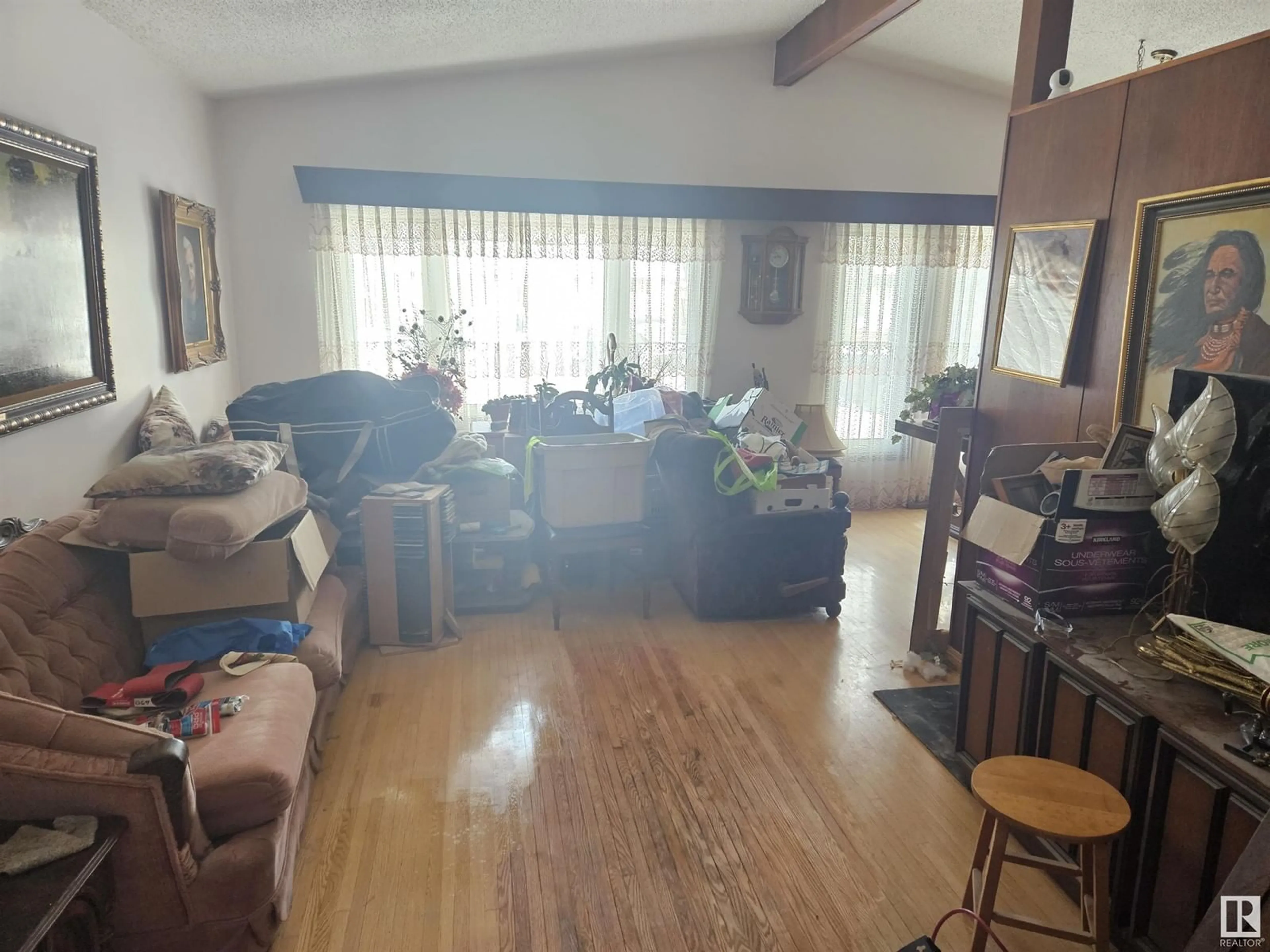 Living room with furniture, wood/laminate floor for 16509 92A AV NW NW, Edmonton Alberta T5R5G5