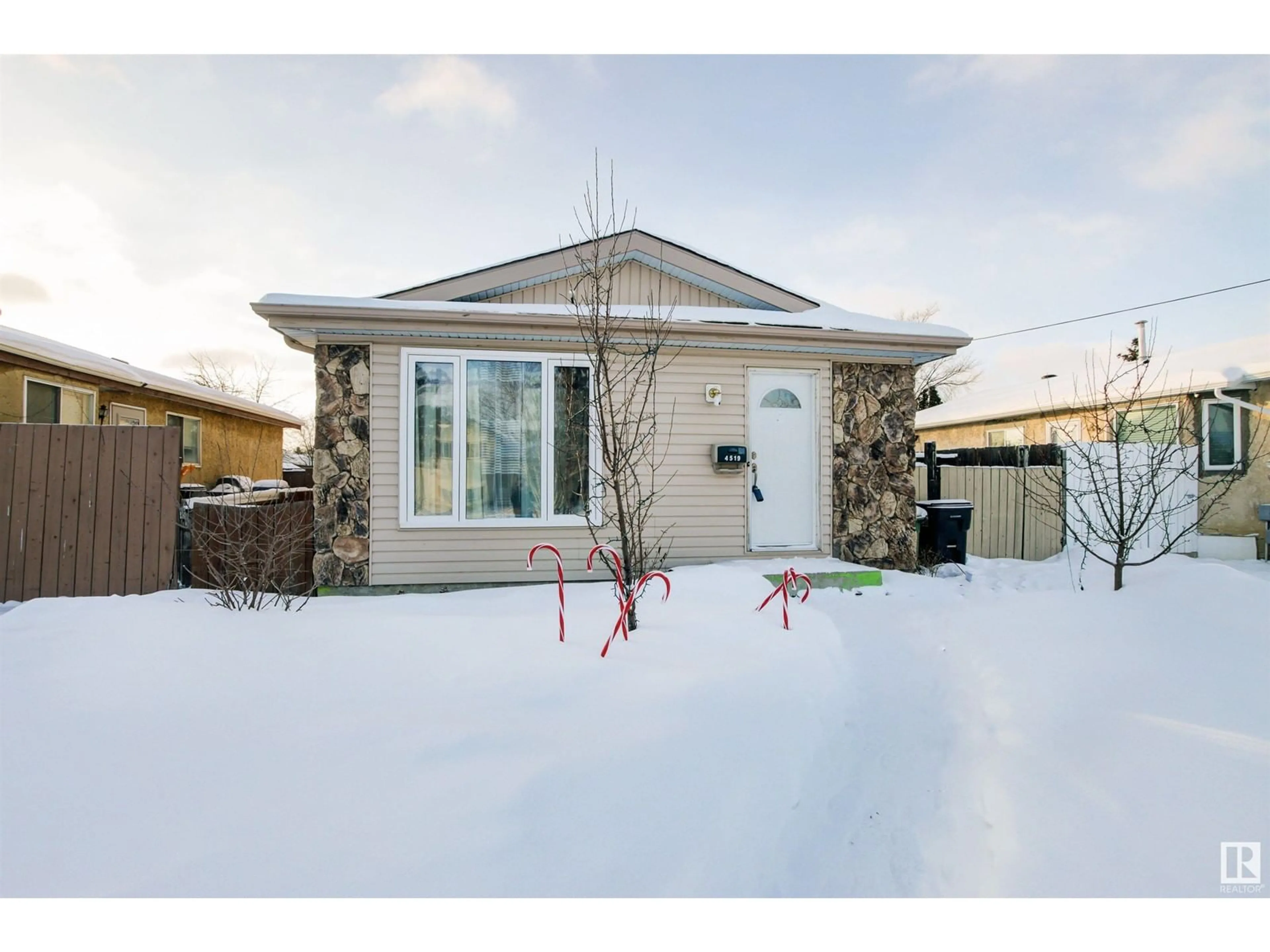 Home with vinyl exterior material, street for 4519 32A AV NW, Edmonton Alberta T6L4K7