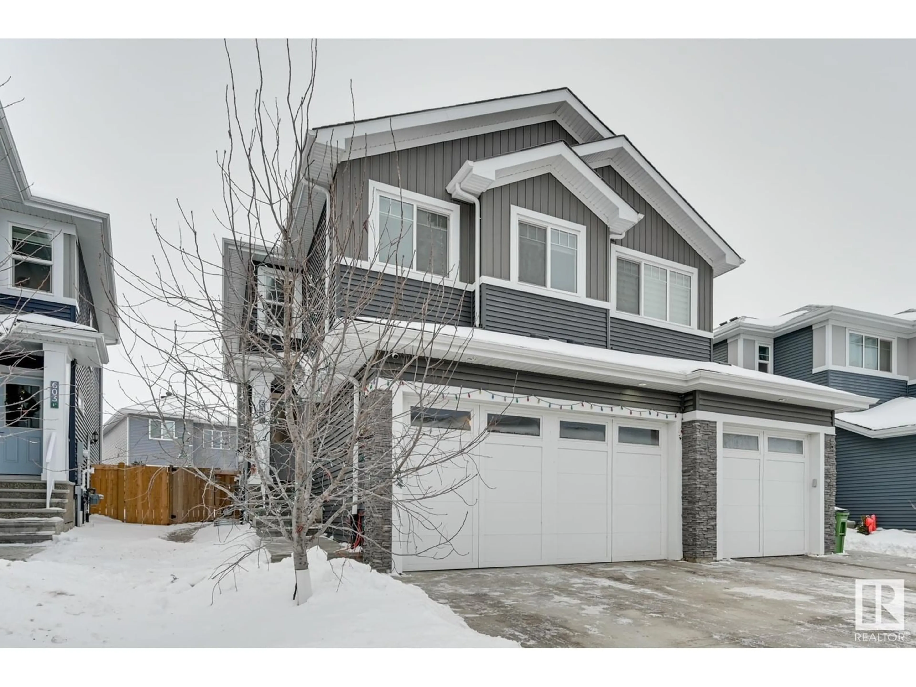 Home with vinyl exterior material, street for 605 GLENRIDDING RAVINE DR SW, Edmonton Alberta T6W4N9