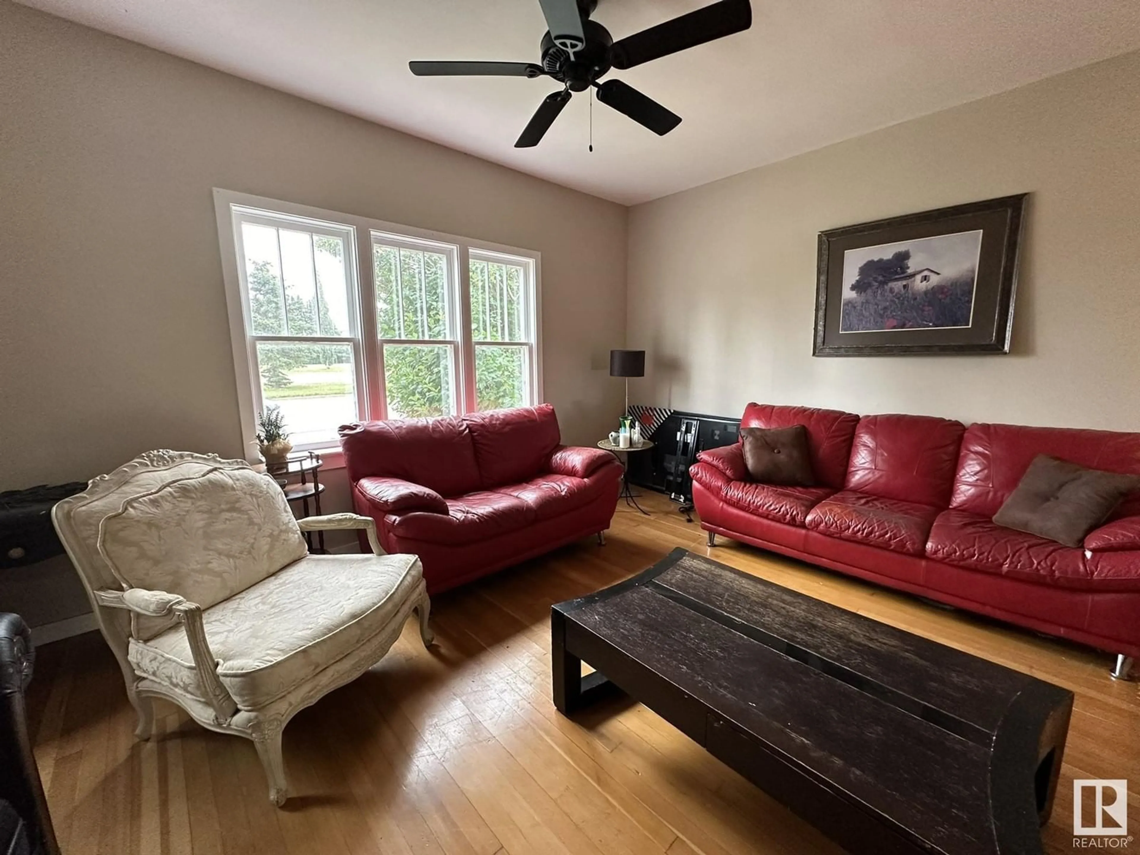 Living room with furniture, wood/laminate floor for 328 West Railway DR, Smoky Lake Town Alberta T0A3C0