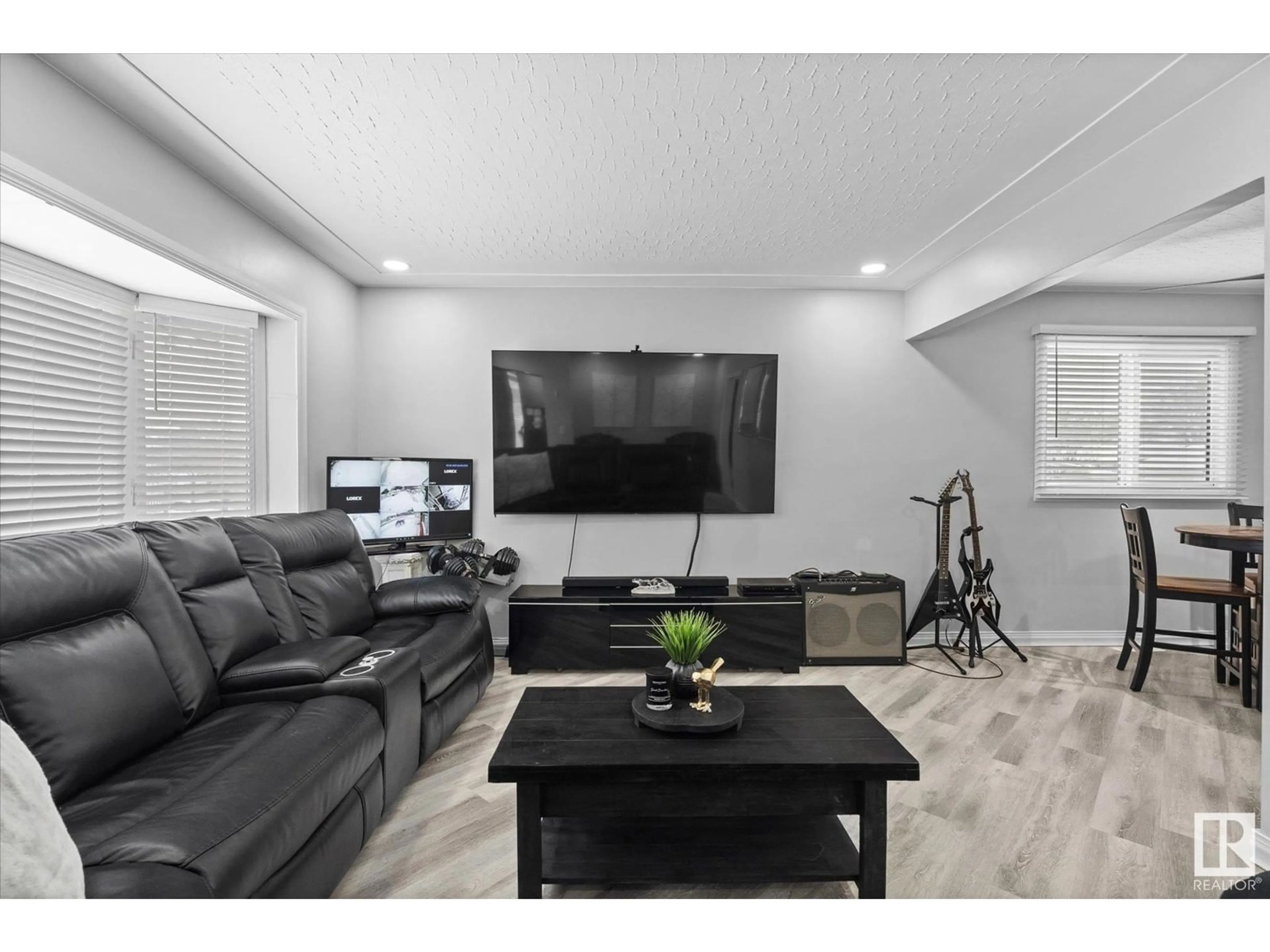 Living room with furniture, wood/laminate floor for 12114 77 ST NW, Edmonton Alberta T5B2G8