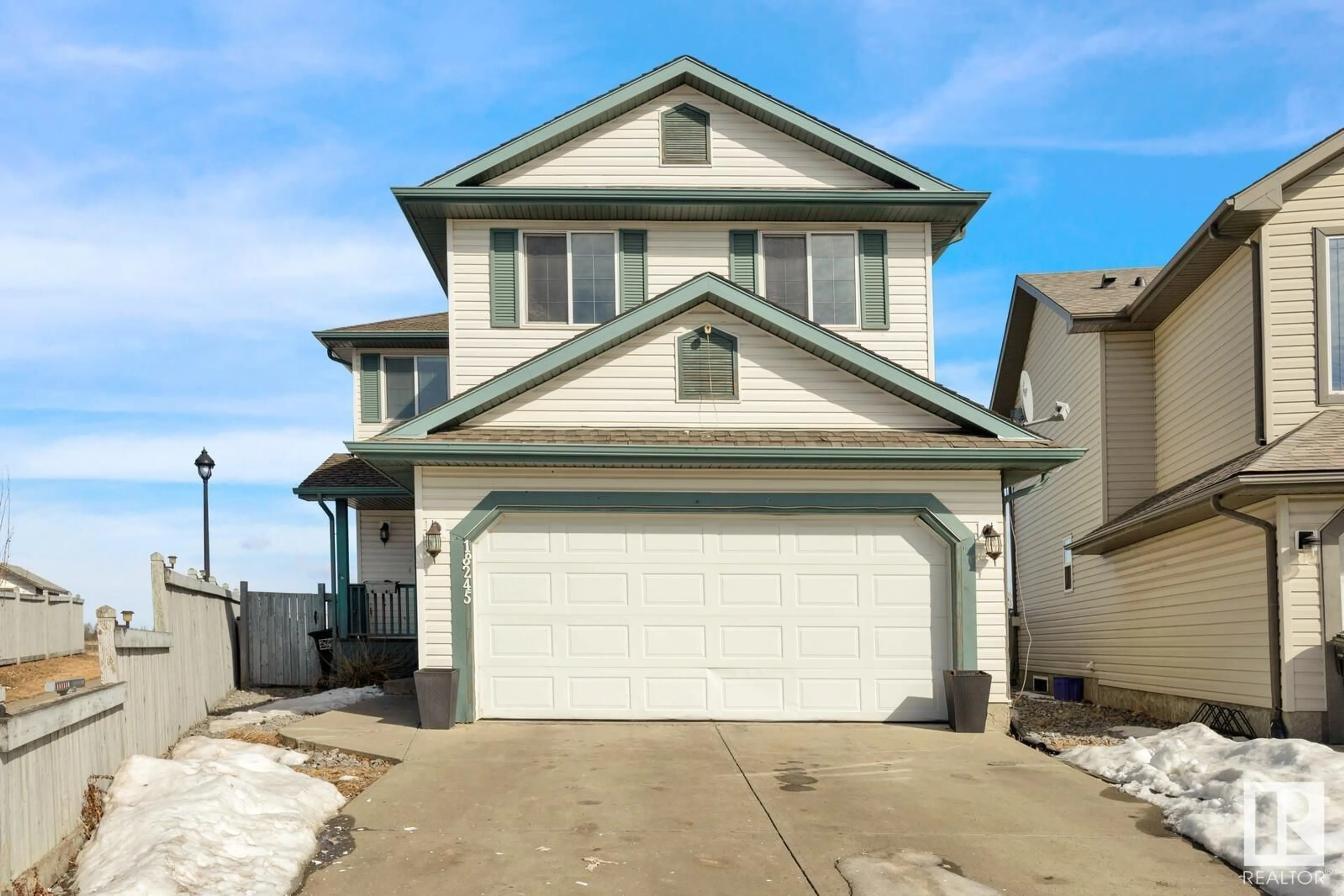 Home with vinyl exterior material, street for 18245 107A ST NW, Edmonton Alberta T5X6E2