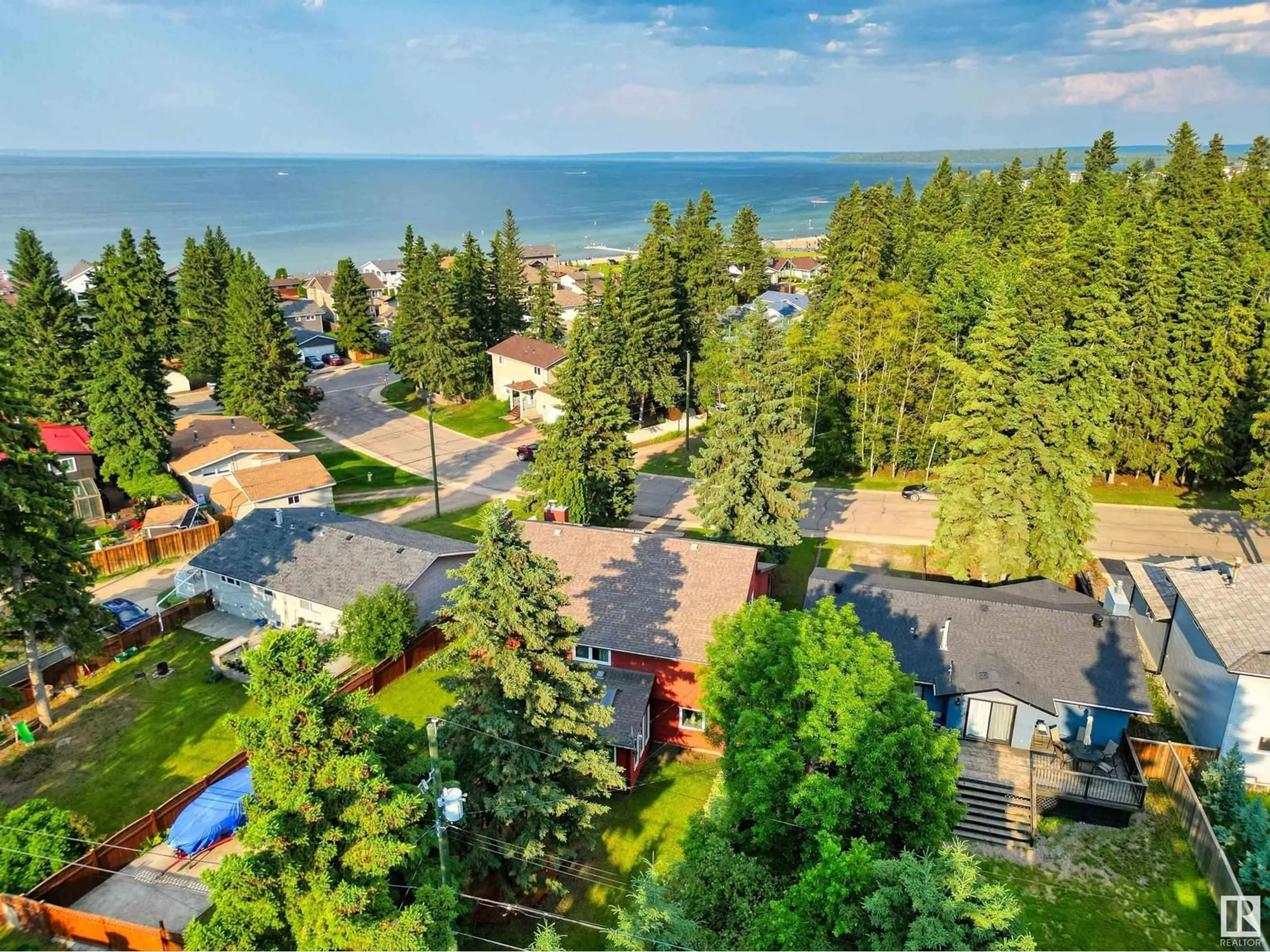 A pic from outside/outdoor area/front of a property/back of a property/a pic from drone, water/lake/river/ocean view for 109 Spruce ST, Cold Lake Alberta T9M1E7