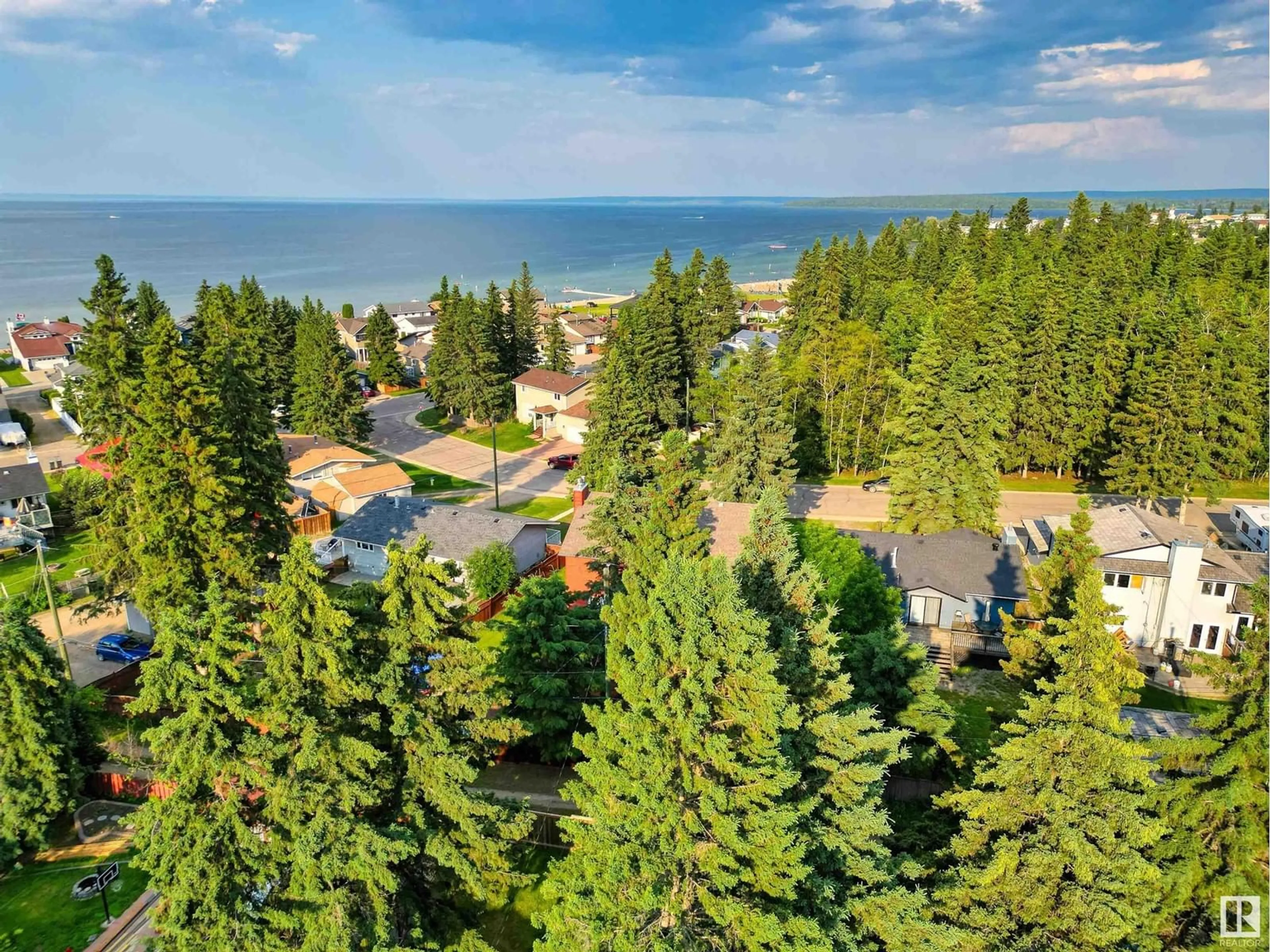 A pic from outside/outdoor area/front of a property/back of a property/a pic from drone, water/lake/river/ocean view for 109 Spruce ST, Cold Lake Alberta T9M1E7