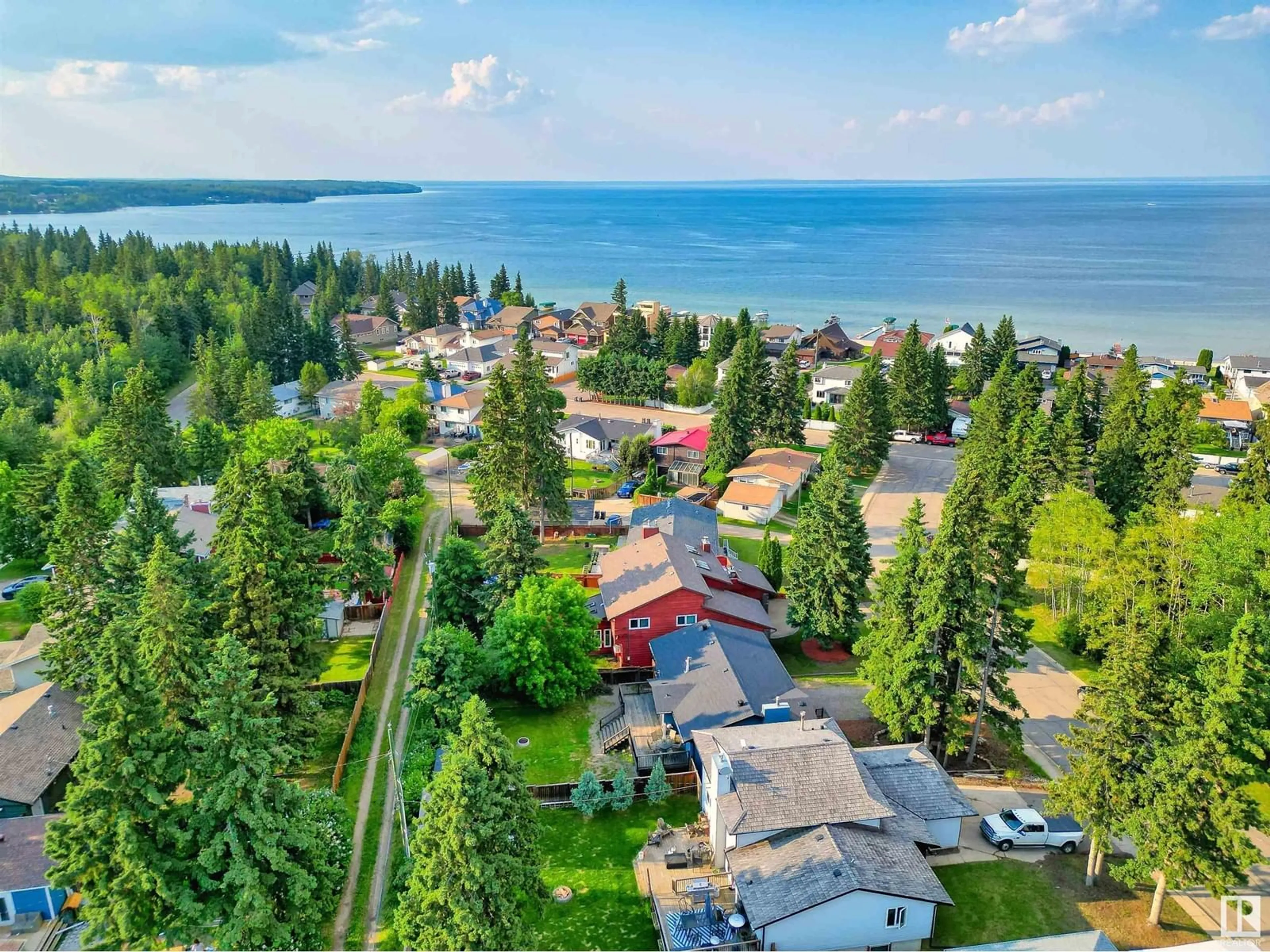 A pic from outside/outdoor area/front of a property/back of a property/a pic from drone, water/lake/river/ocean view for 109 Spruce ST, Cold Lake Alberta T9M1E7