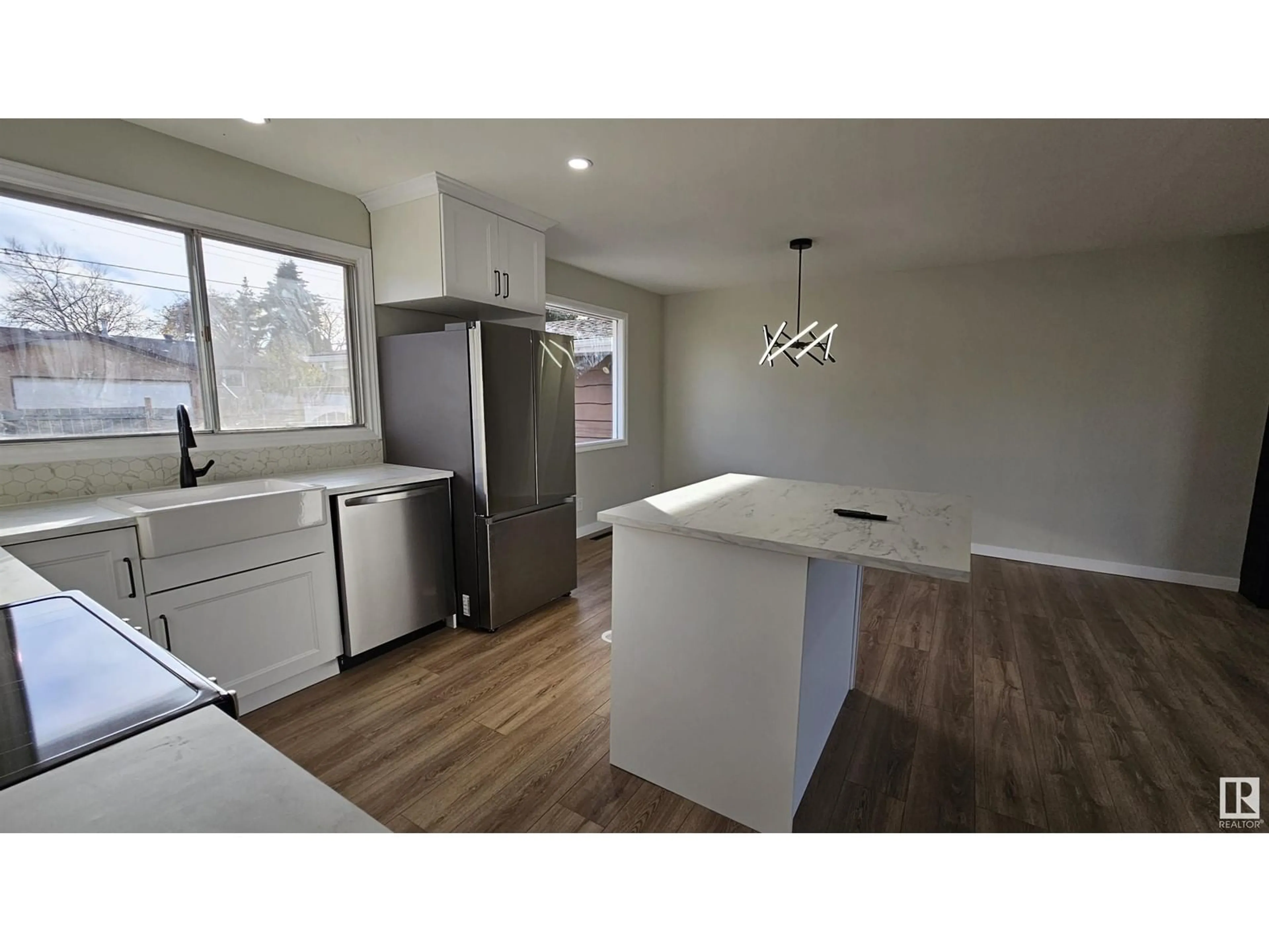 Open concept kitchen, wood/laminate floor for 6507 45A AV, Camrose Alberta T4V0C8