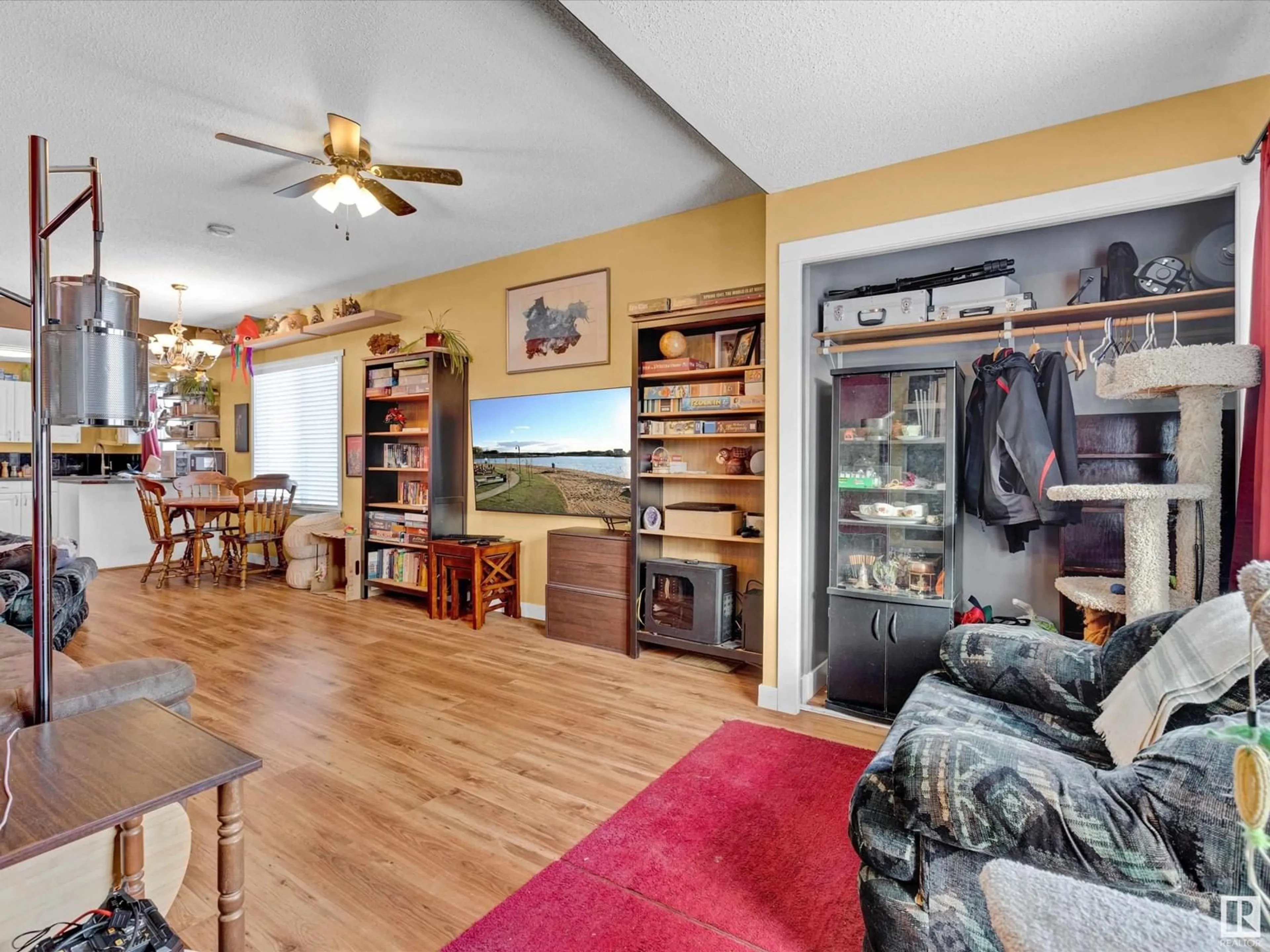 Living room with furniture, wood/laminate floor for 9514 106A AV NW, Edmonton Alberta T5H0S8