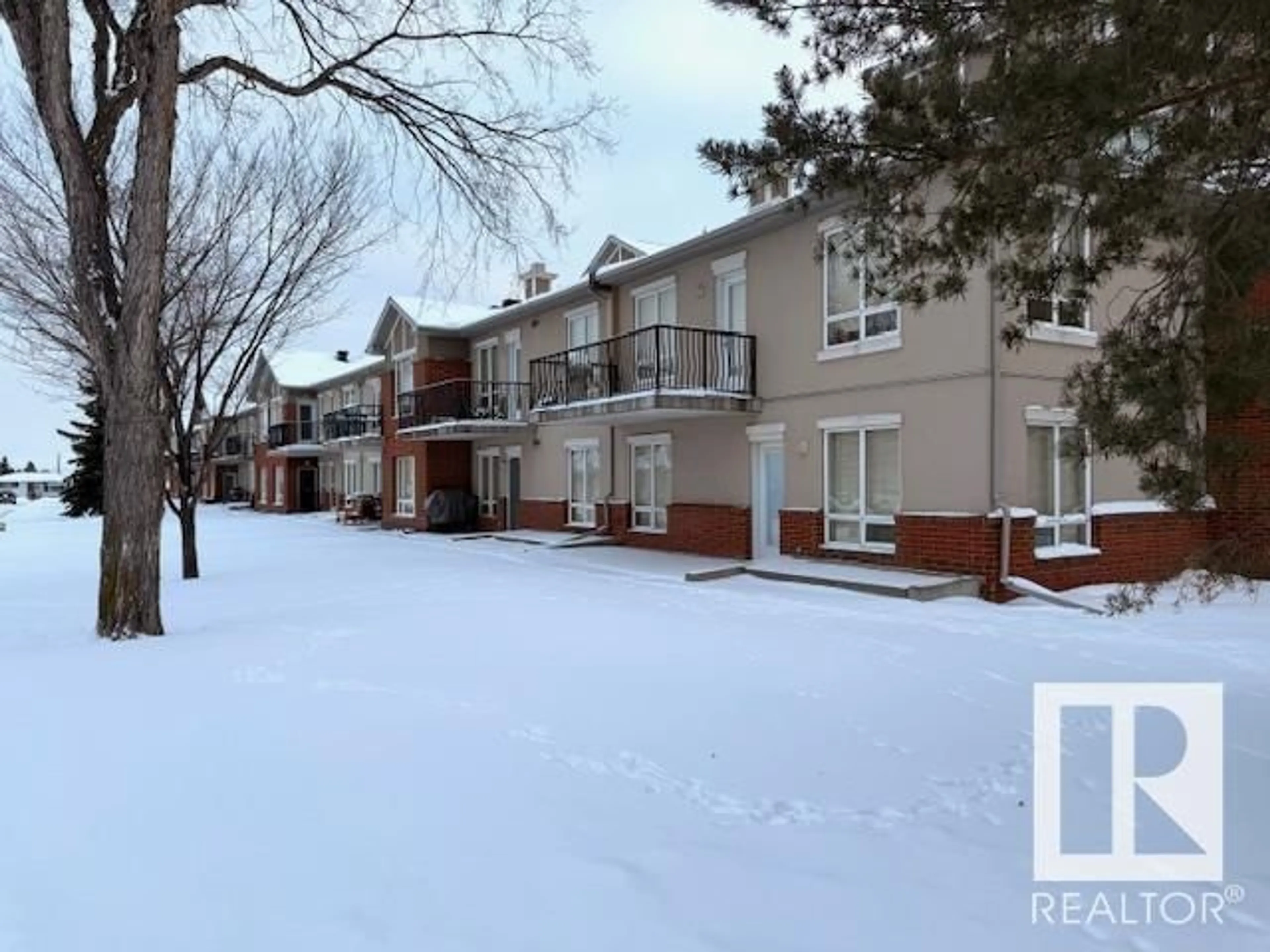 A pic from outside/outdoor area/front of a property/back of a property/a pic from drone, street for #207 6315 135 AV NW, Edmonton Alberta T5A5J7