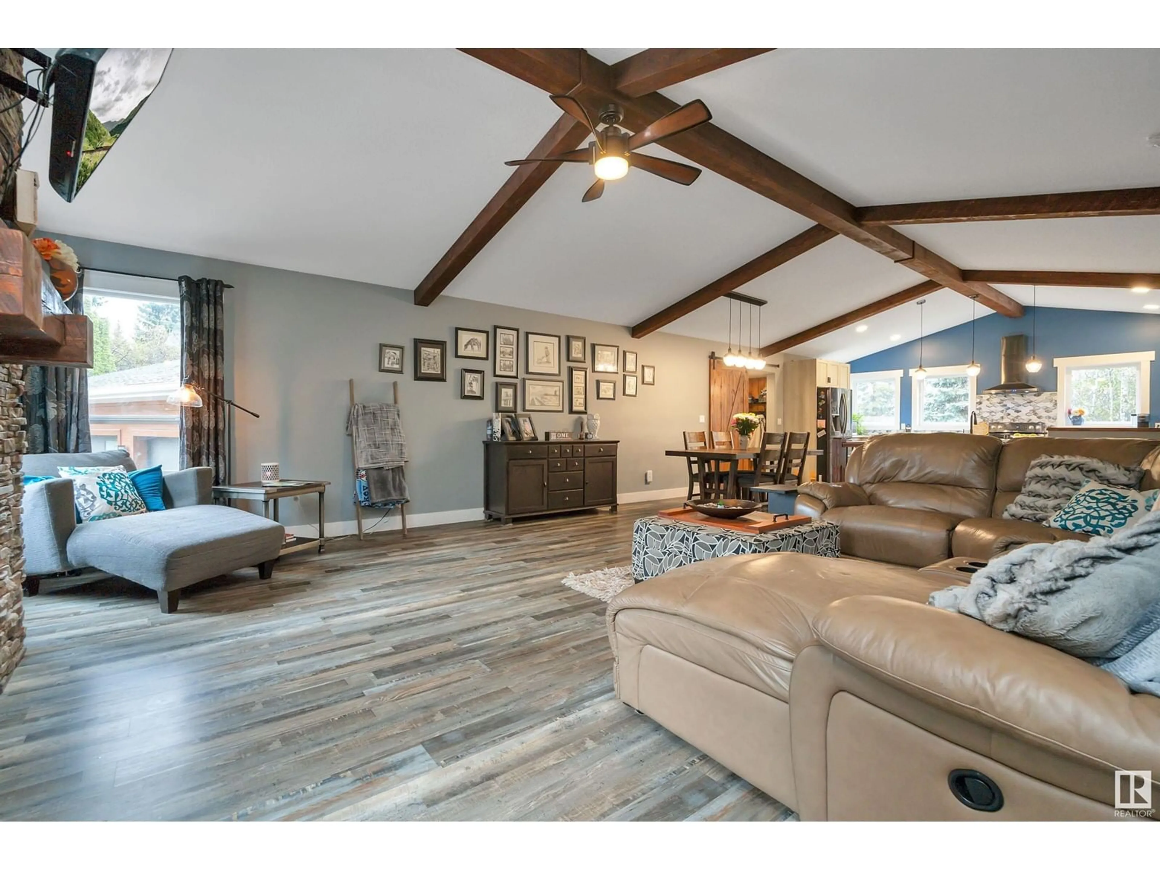 Living room with furniture, wood/laminate floor for 49124 RGE RD 275, Rural Leduc County Alberta T0C2P0