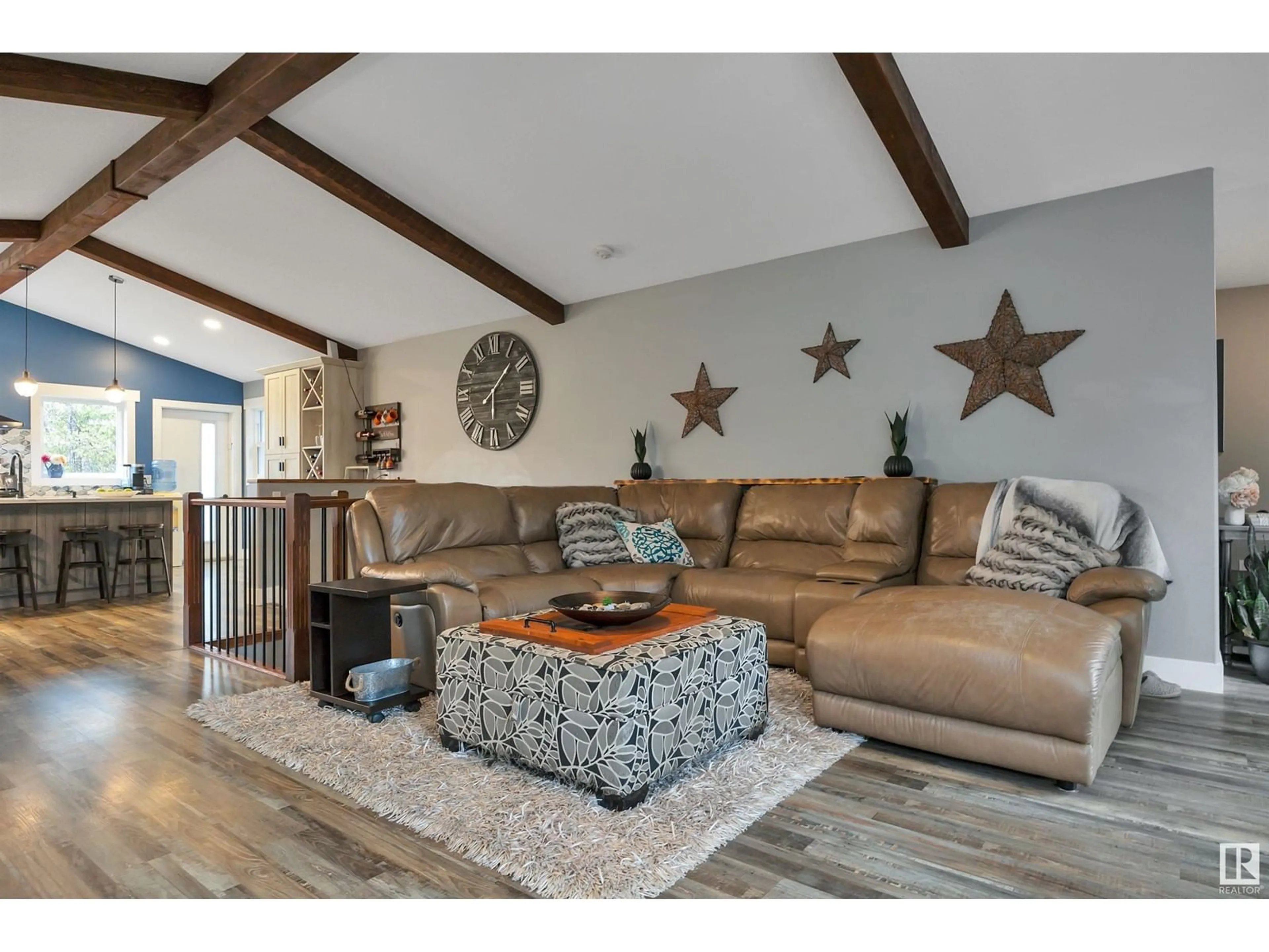 Living room with furniture, wood/laminate floor for 49124 RGE RD 275, Rural Leduc County Alberta T0C2P0