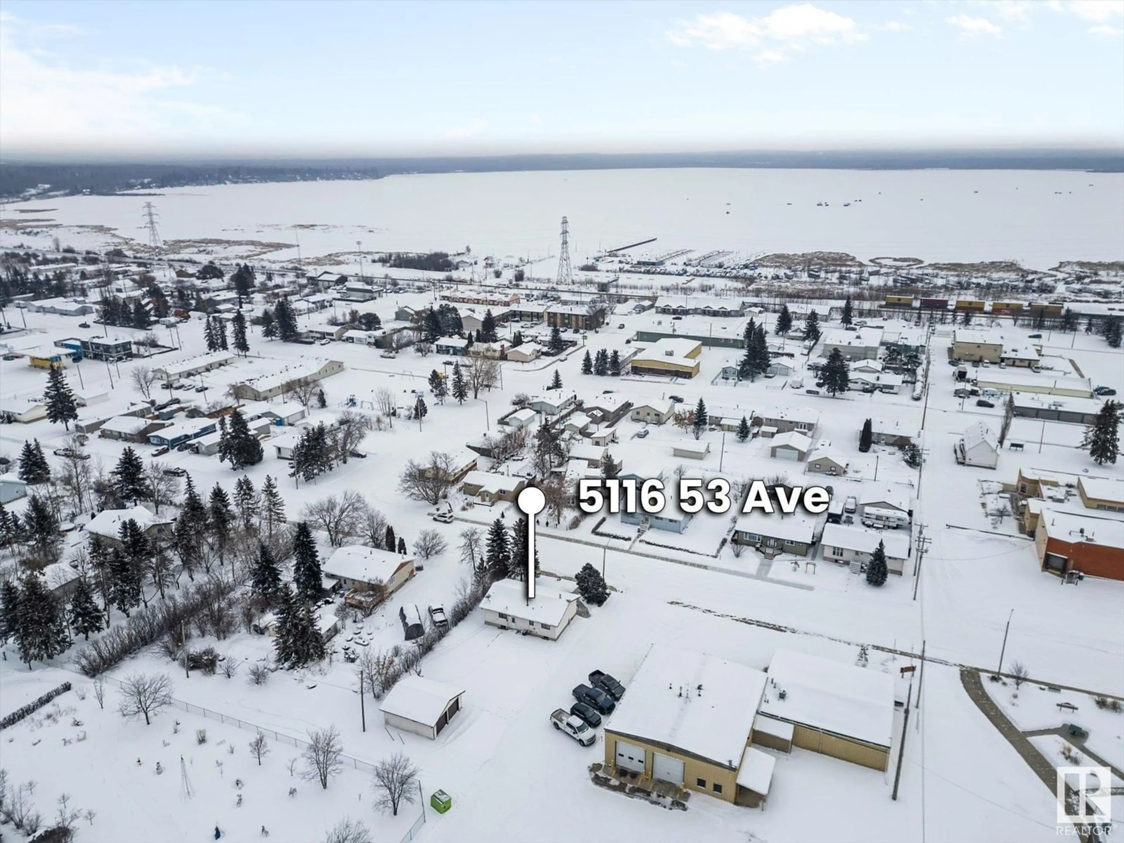 A pic from outside/outdoor area/front of a property/back of a property/a pic from drone, water/lake/river/ocean view for 5116 53 AV, Wabamun Alberta T0E2K0