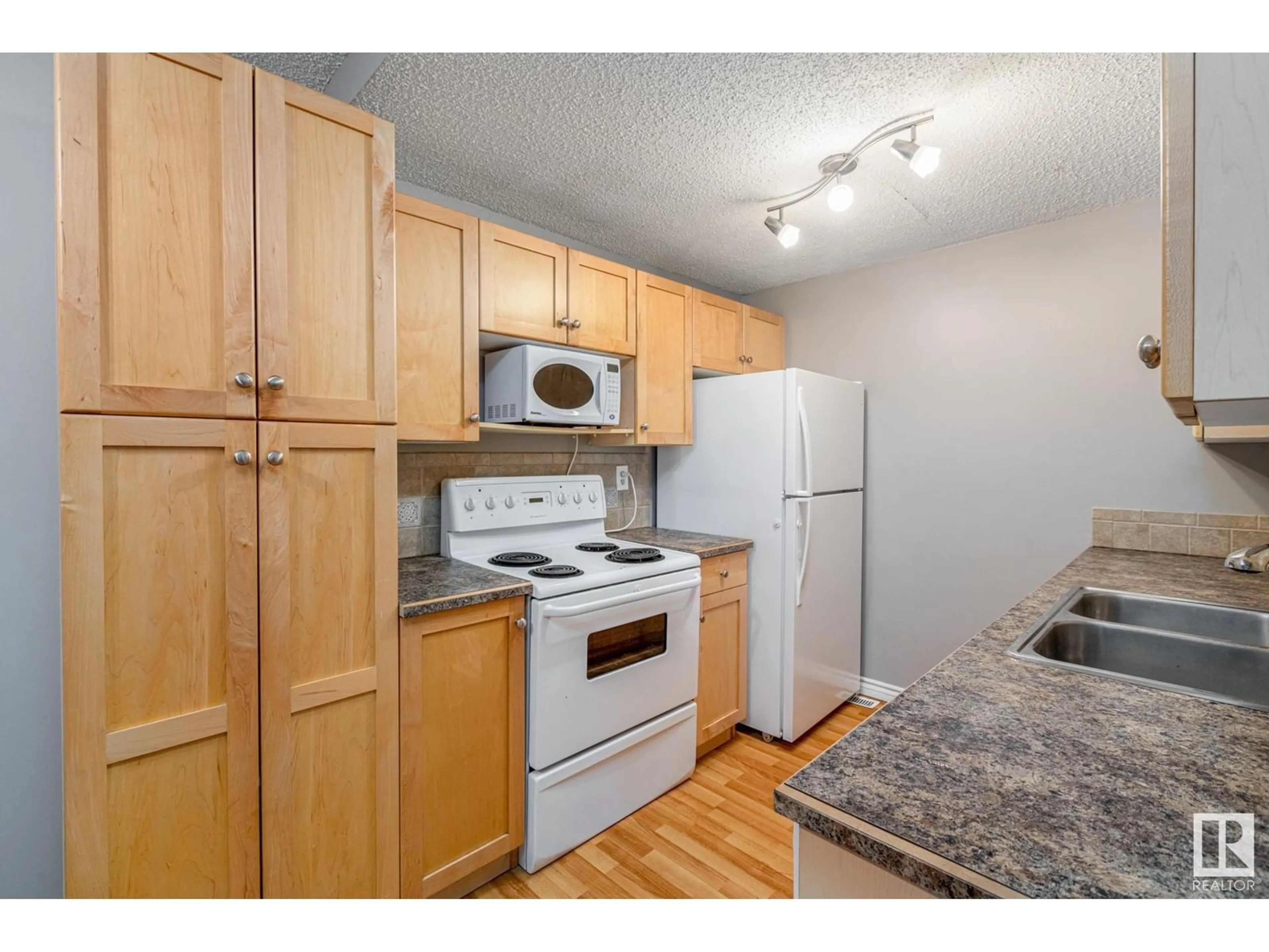 Standard kitchen, wood/laminate floor for 14417 54 ST NW, Edmonton Alberta T5A3N3