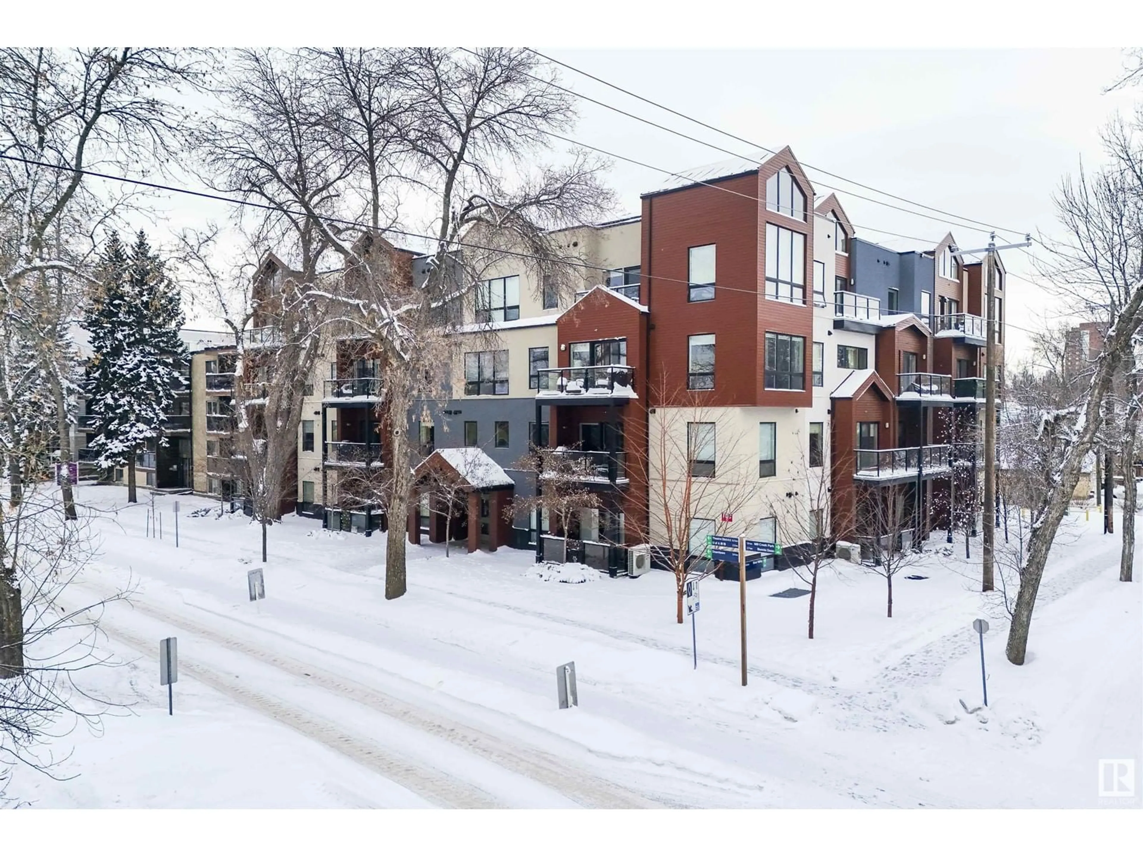 A pic from outside/outdoor area/front of a property/back of a property/a pic from drone, street for #107 10006 83 AV NW, Edmonton Alberta T6E2C2