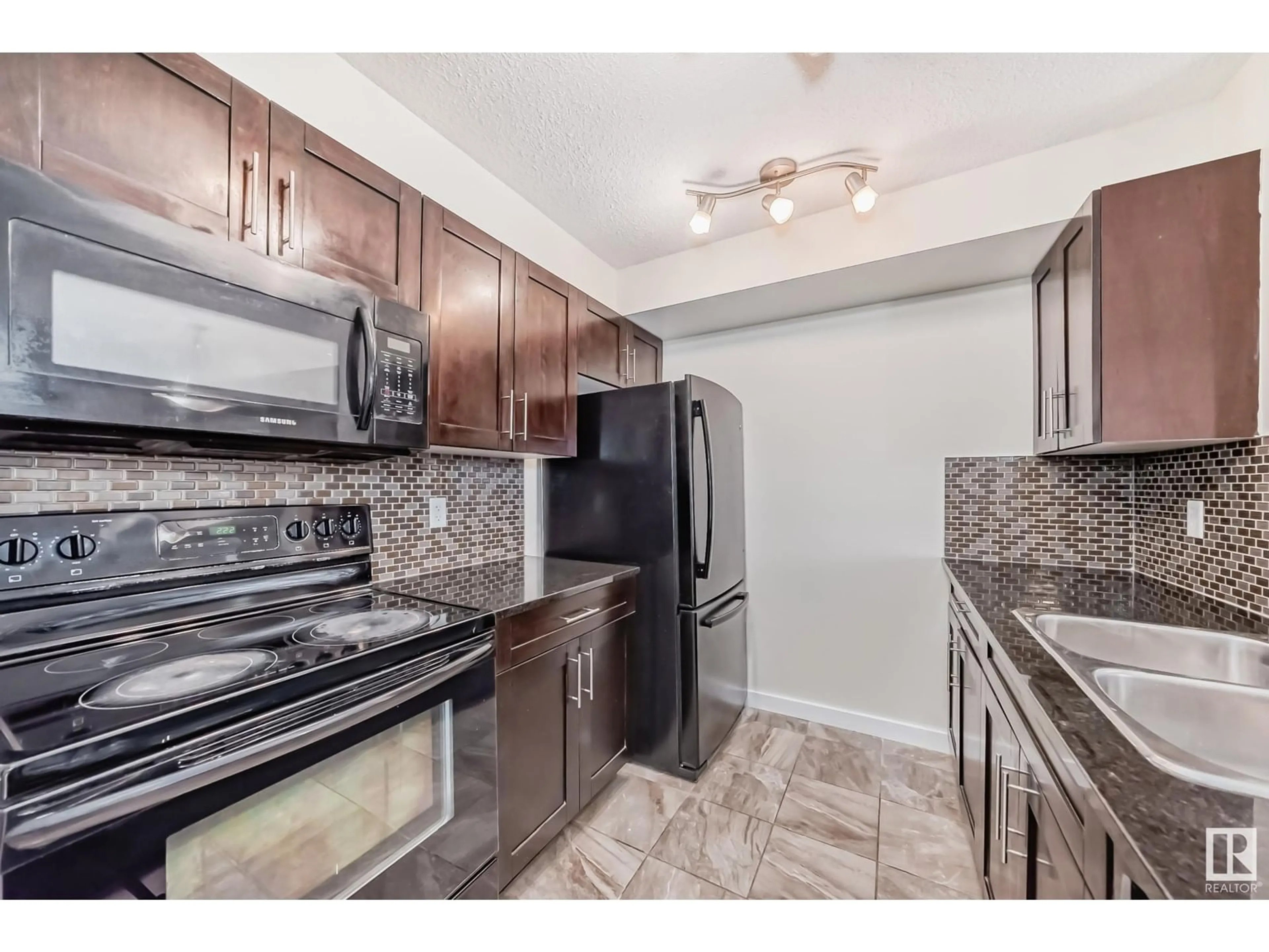 Standard kitchen, ceramic/tile floor for #207 5370 CHAPPELLE RD SW, Edmonton Alberta T6W3L5