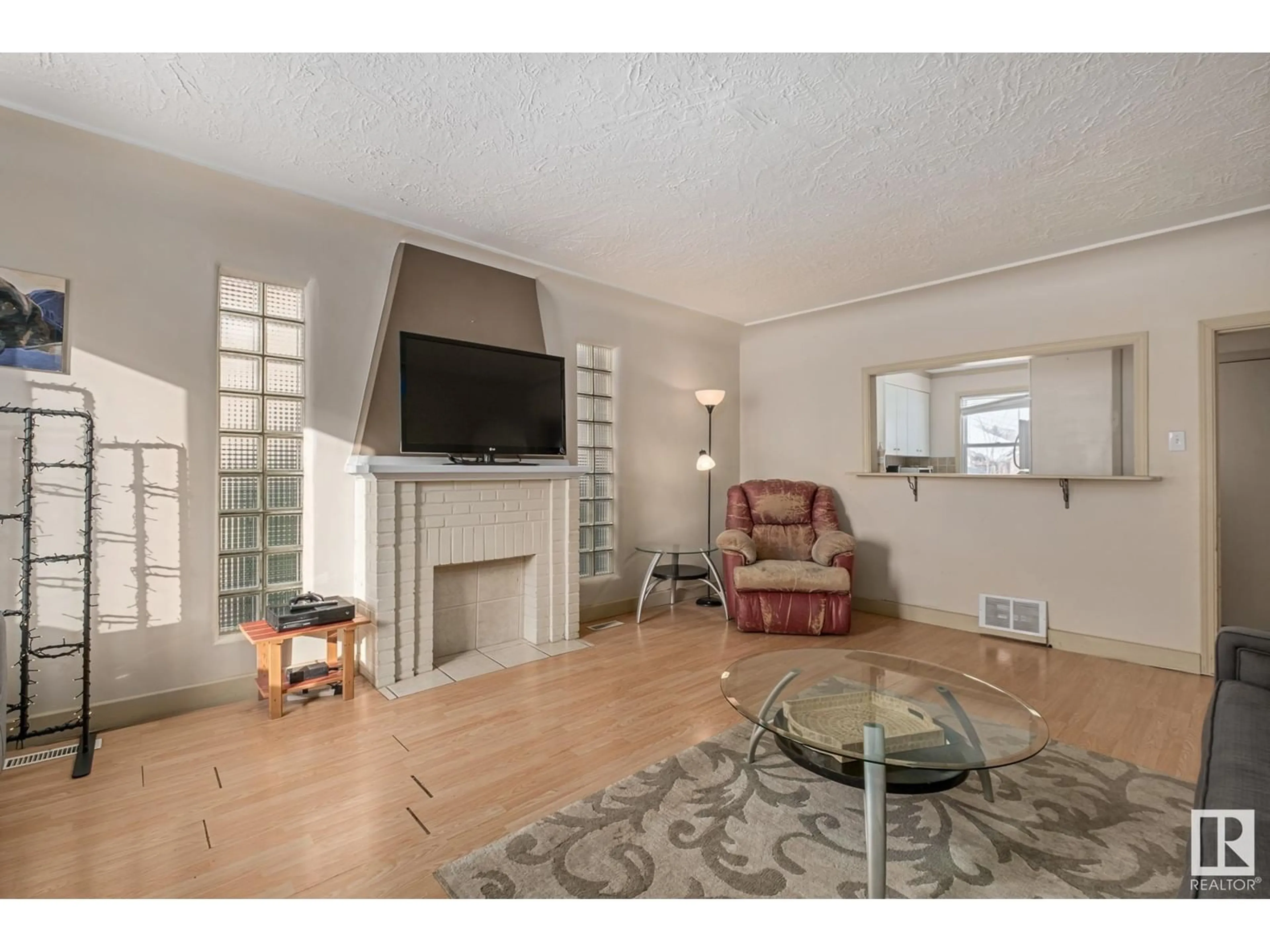 Living room with furniture, unknown for 8906 112 AV NW, Edmonton Alberta T5B0G9