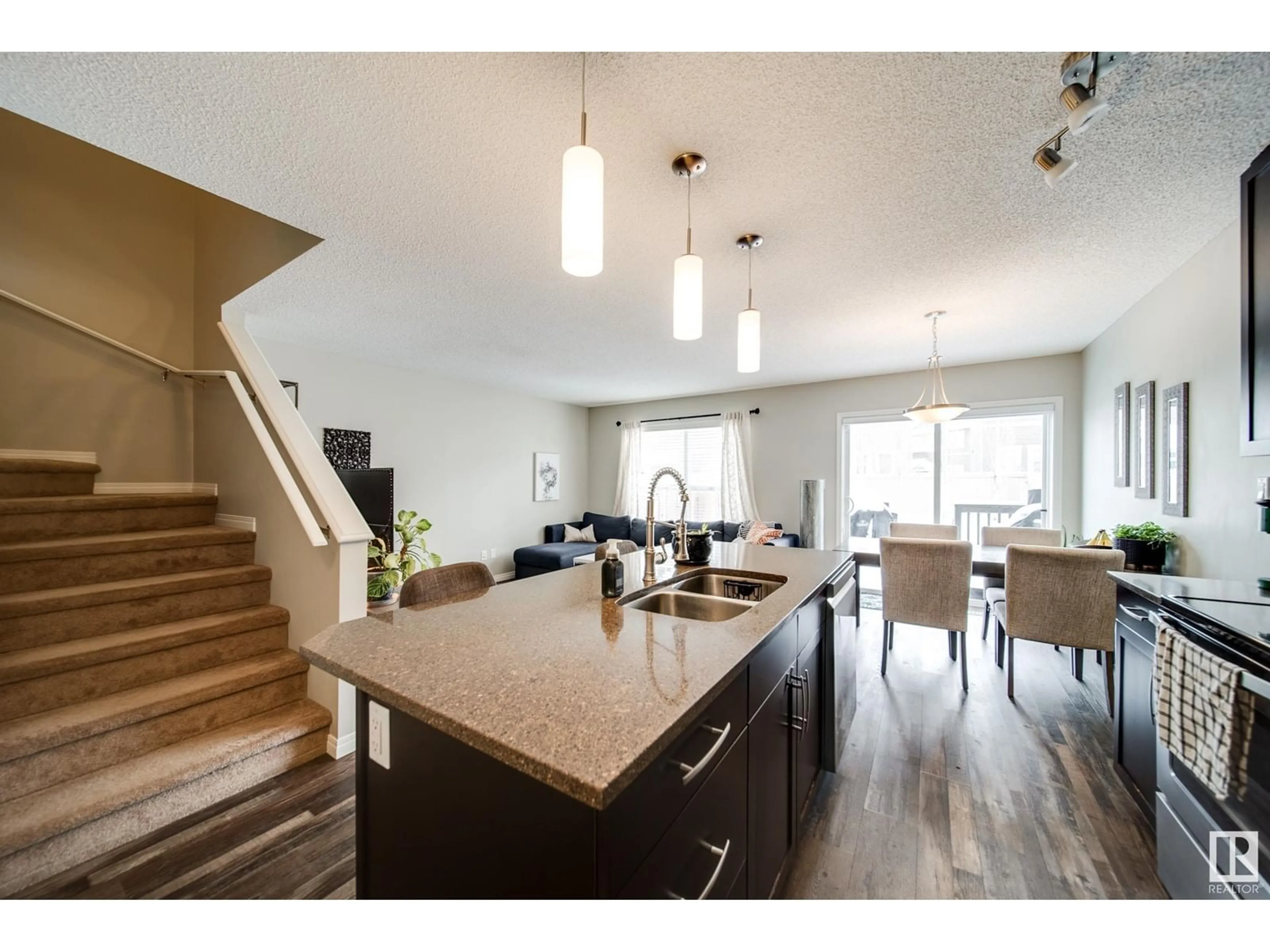 Open concept kitchen, wood/laminate floor for 1733 CHAPMAN WY SW, Edmonton Alberta T6W2E8