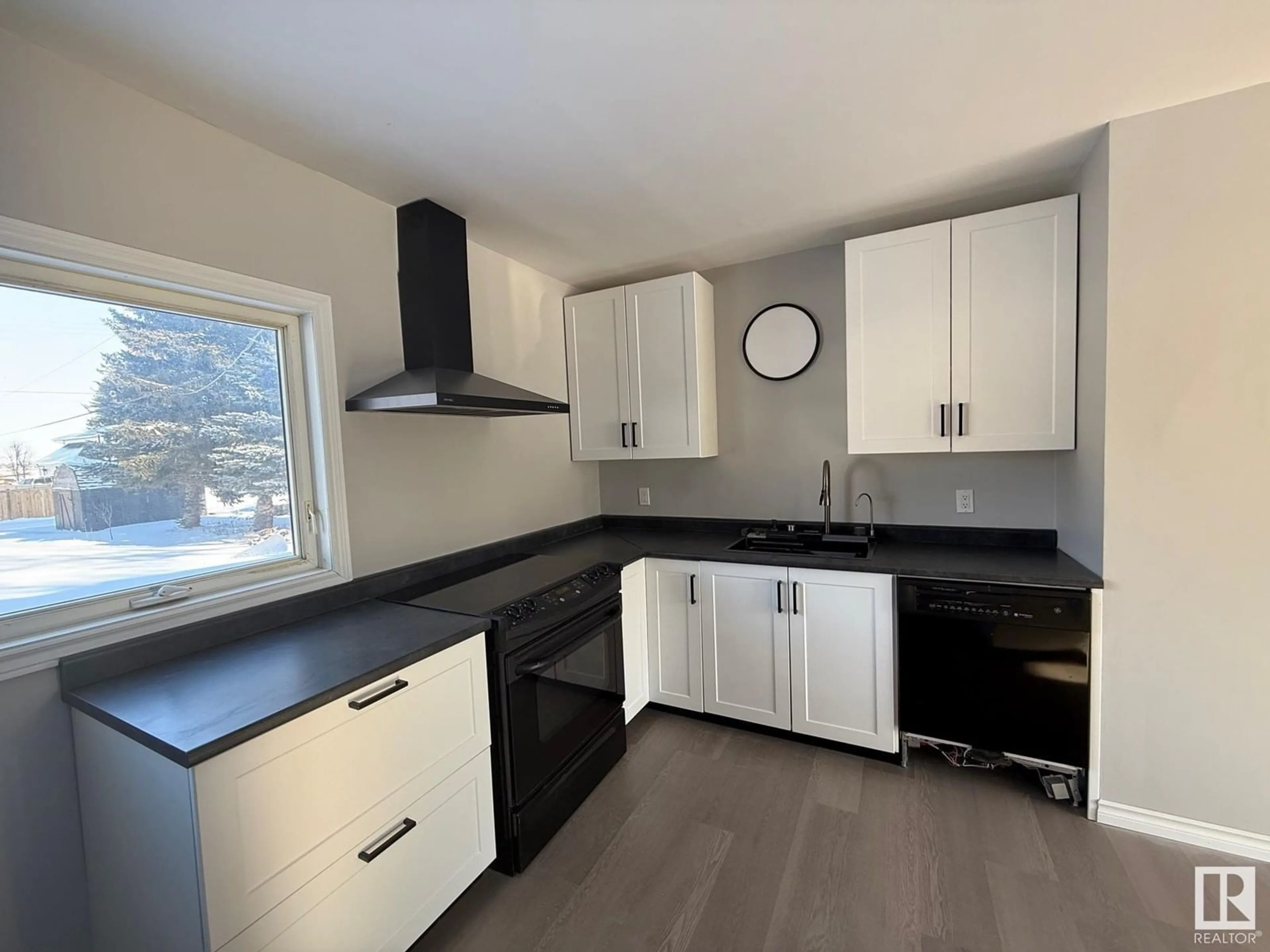 Open concept kitchen, wood/laminate floor for 4920 55 AV, Viking Alberta T0B4N0