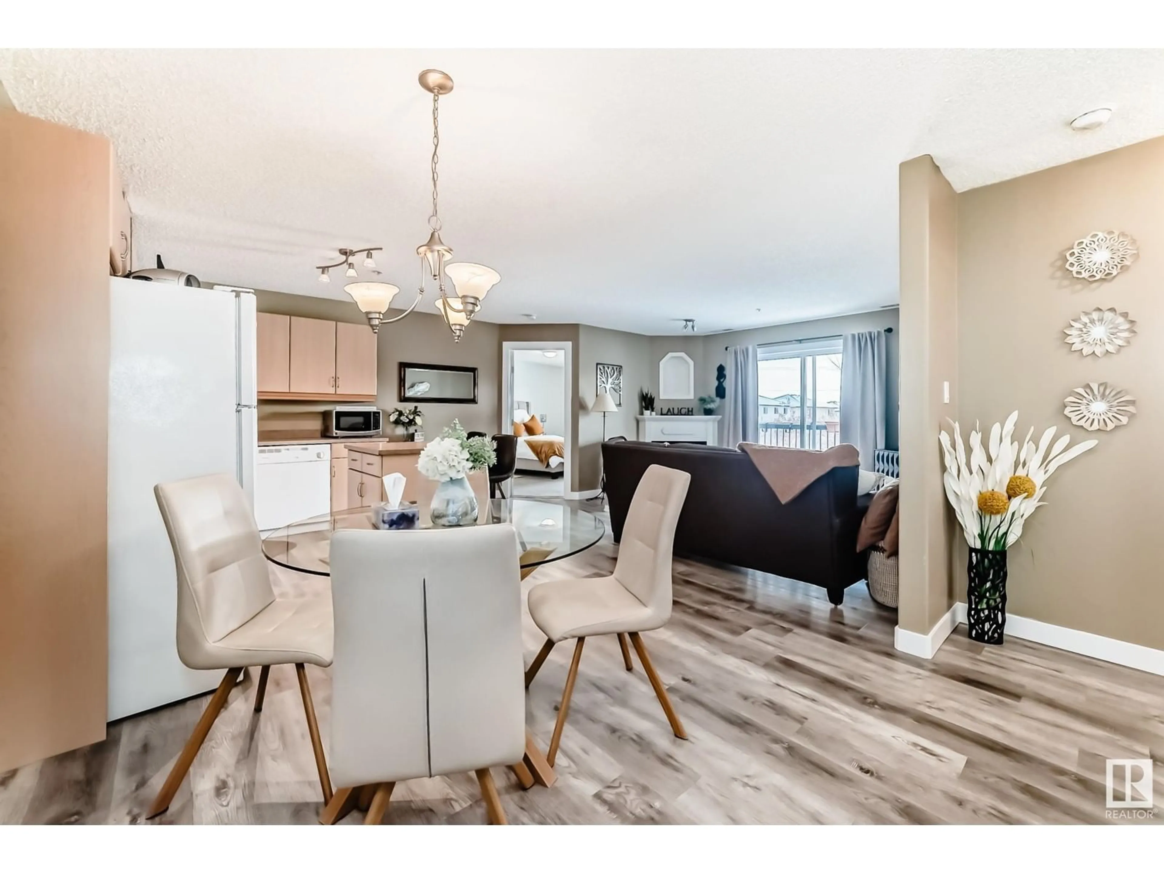 Open concept kitchen, wood/laminate floor for #212 16303 95 ST NW, Edmonton Alberta T5Z3V1