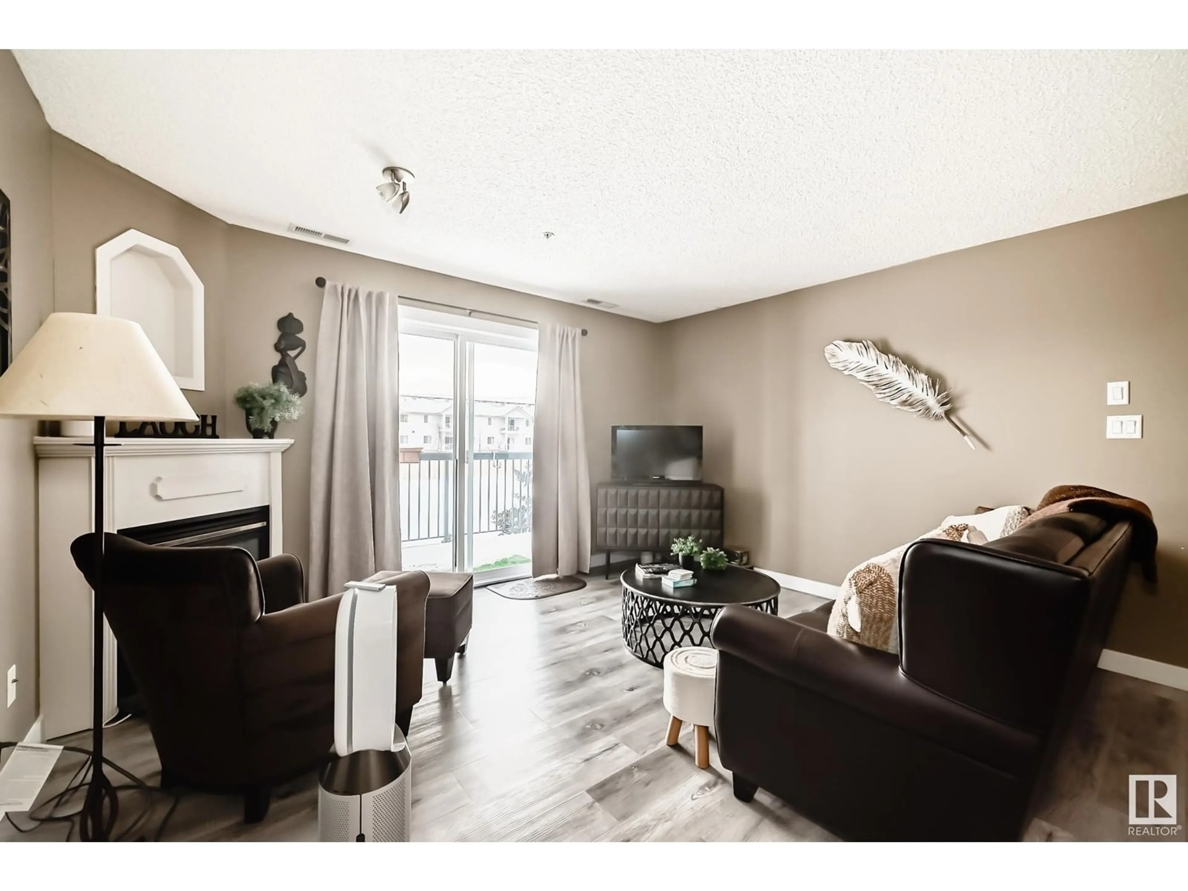 Living room with furniture, wood/laminate floor for #212 16303 95 ST NW, Edmonton Alberta T5Z3V1