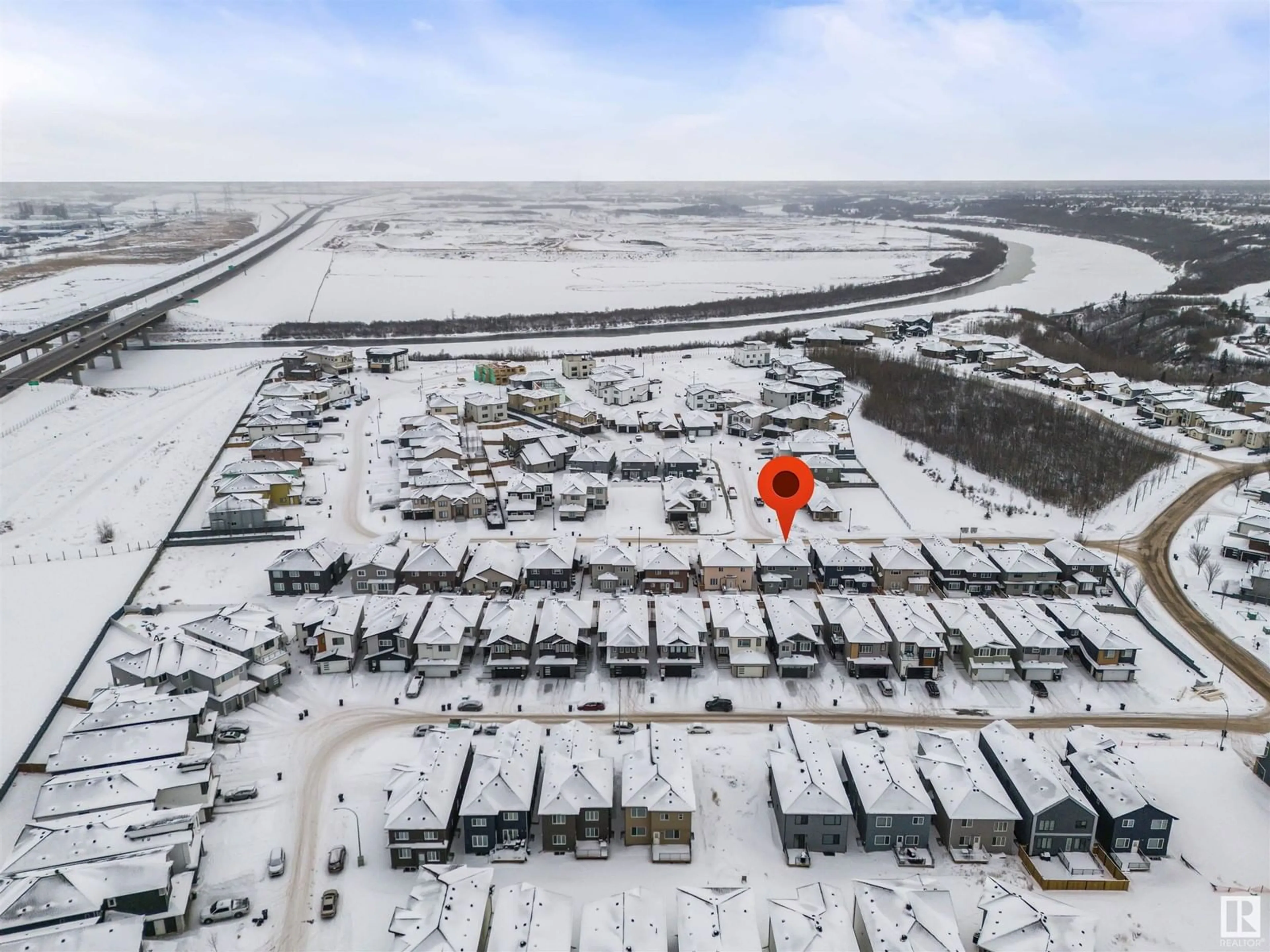 A pic from outside/outdoor area/front of a property/back of a property/a pic from drone, street for 1027 150 AV NW, Edmonton Alberta T5Y4C1