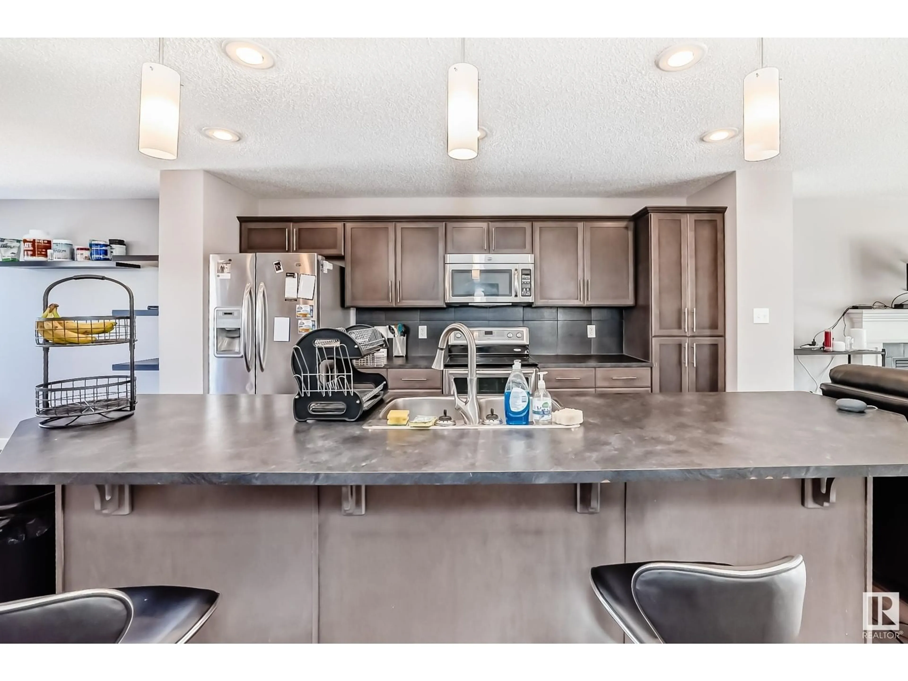 Open concept kitchen, ceramic/tile floor for 17804 6 AV SW, Edmonton Alberta T6W2G6