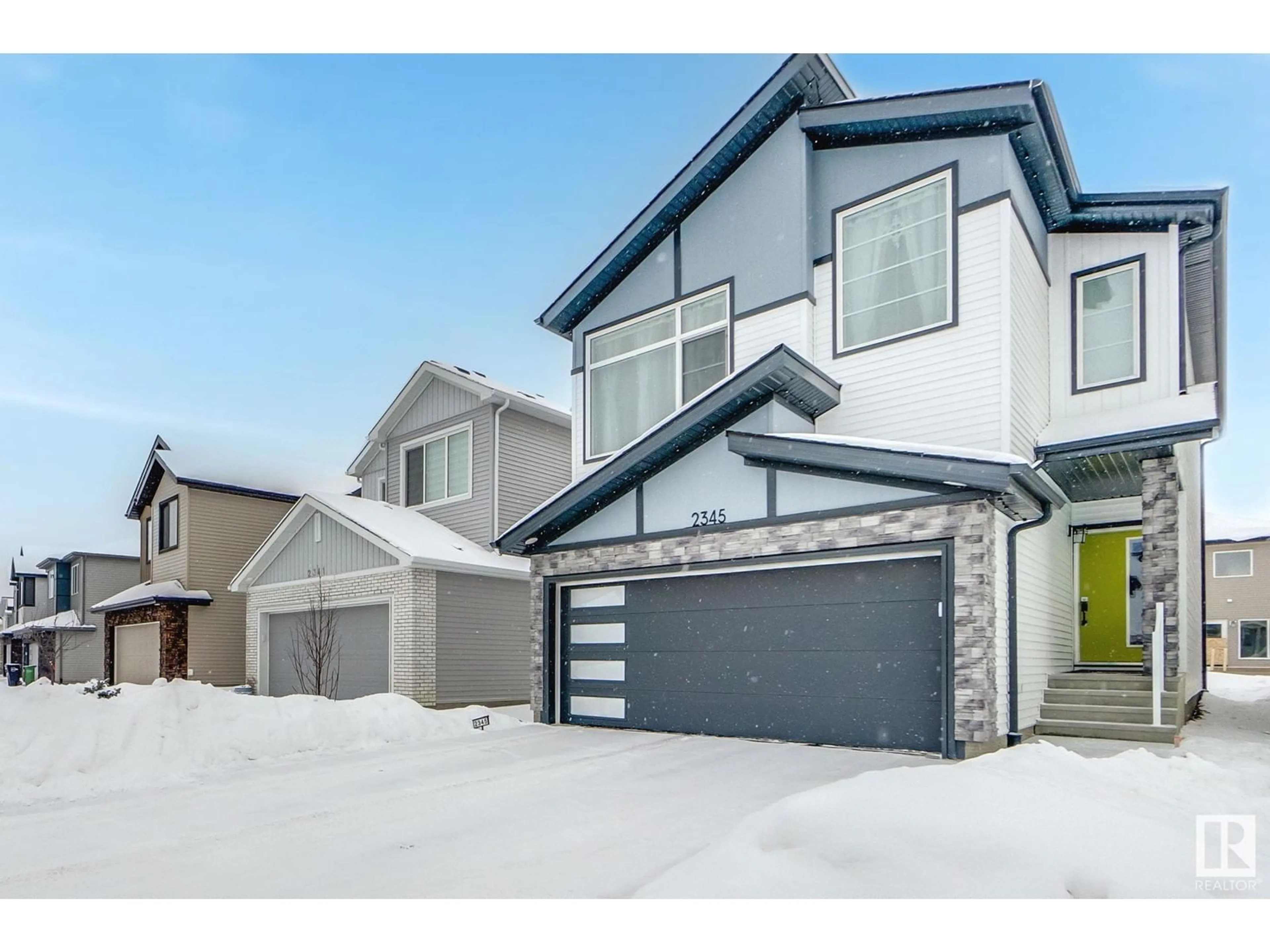 Home with vinyl exterior material, street for 2345 158A Street SW, Edmonton Alberta T6W5K4