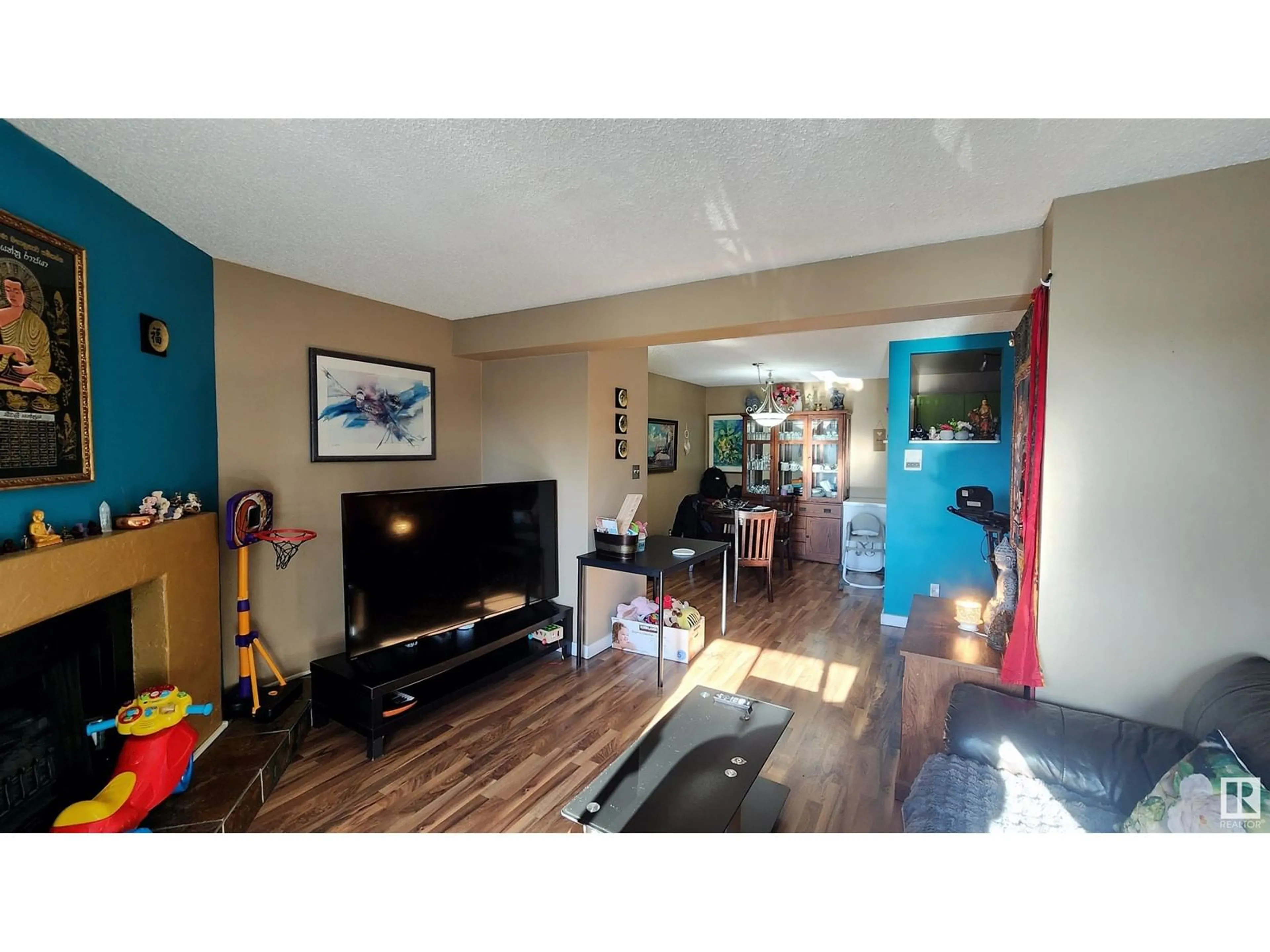 Living room with furniture, wood/laminate floor for 9042 TUDOR GL, St. Albert Alberta T8N3V4