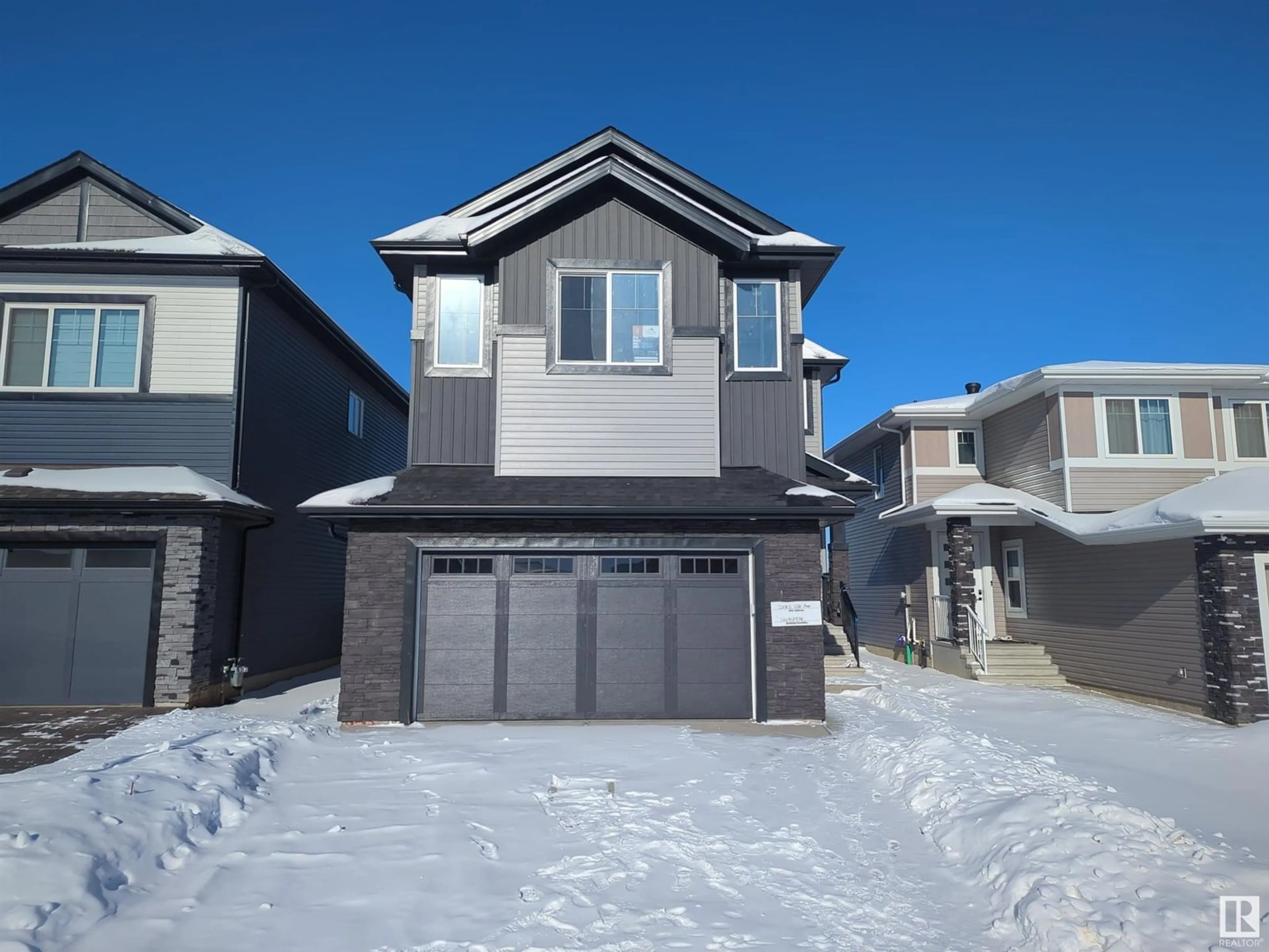 Home with vinyl exterior material, street for 21012 128 AV NW, Edmonton Alberta T5S0R6