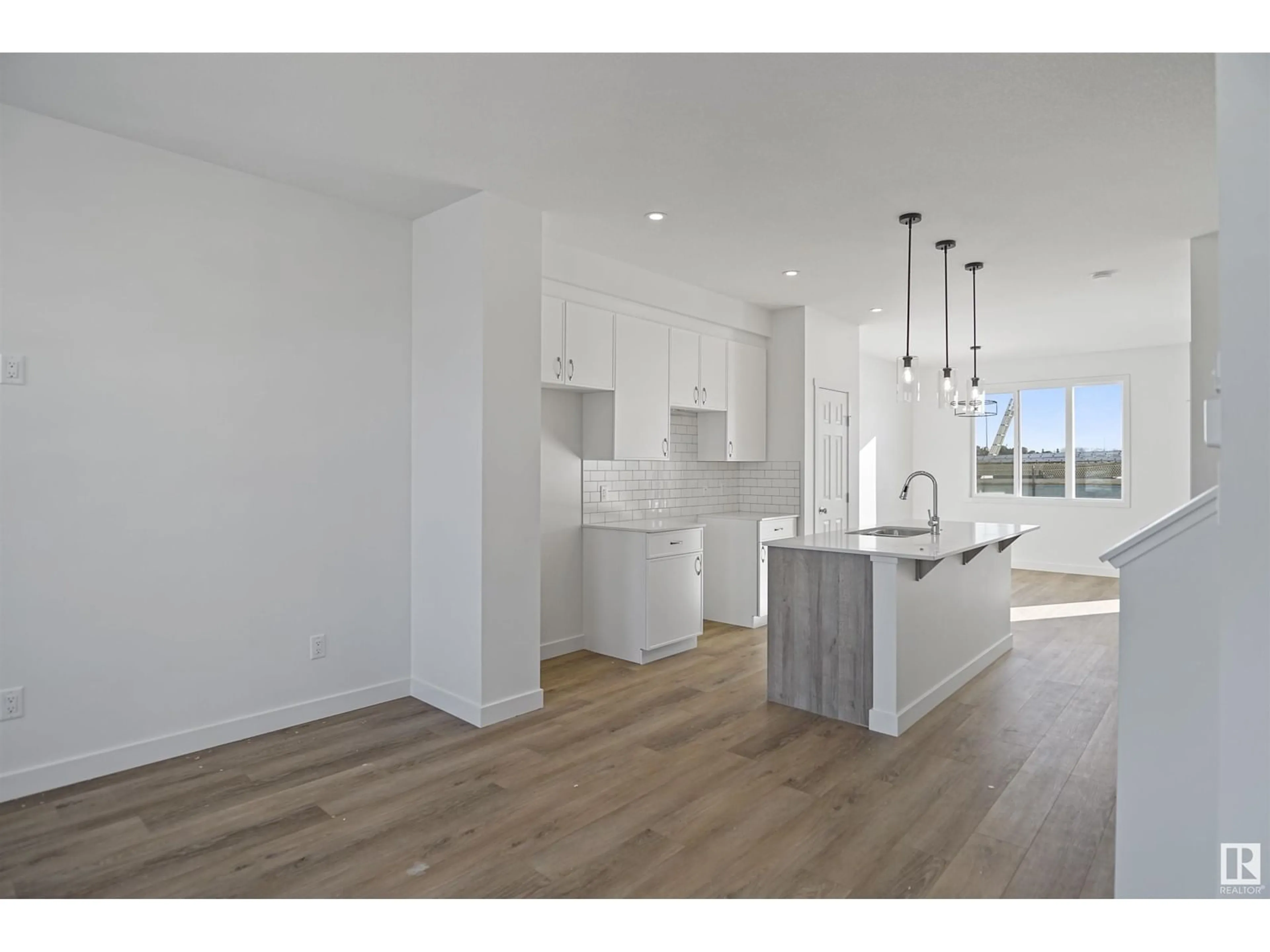 Open concept kitchen, wood/laminate floor for 1252 MCLEOD AV, Spruce Grove Alberta T7X2Z7