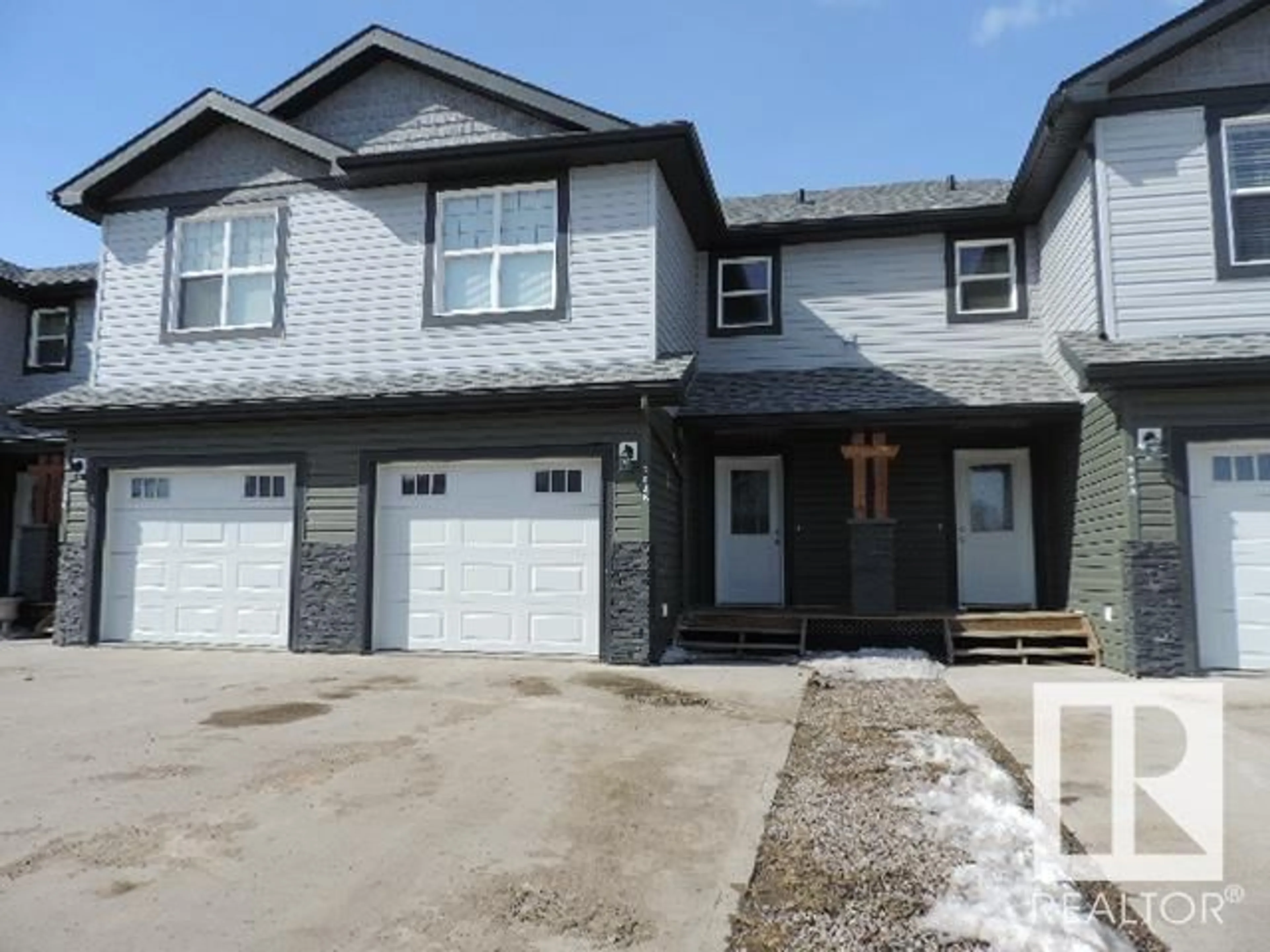 Home with vinyl exterior material, street for 703D Rocky WY, Cold Lake Alberta T9M0H3