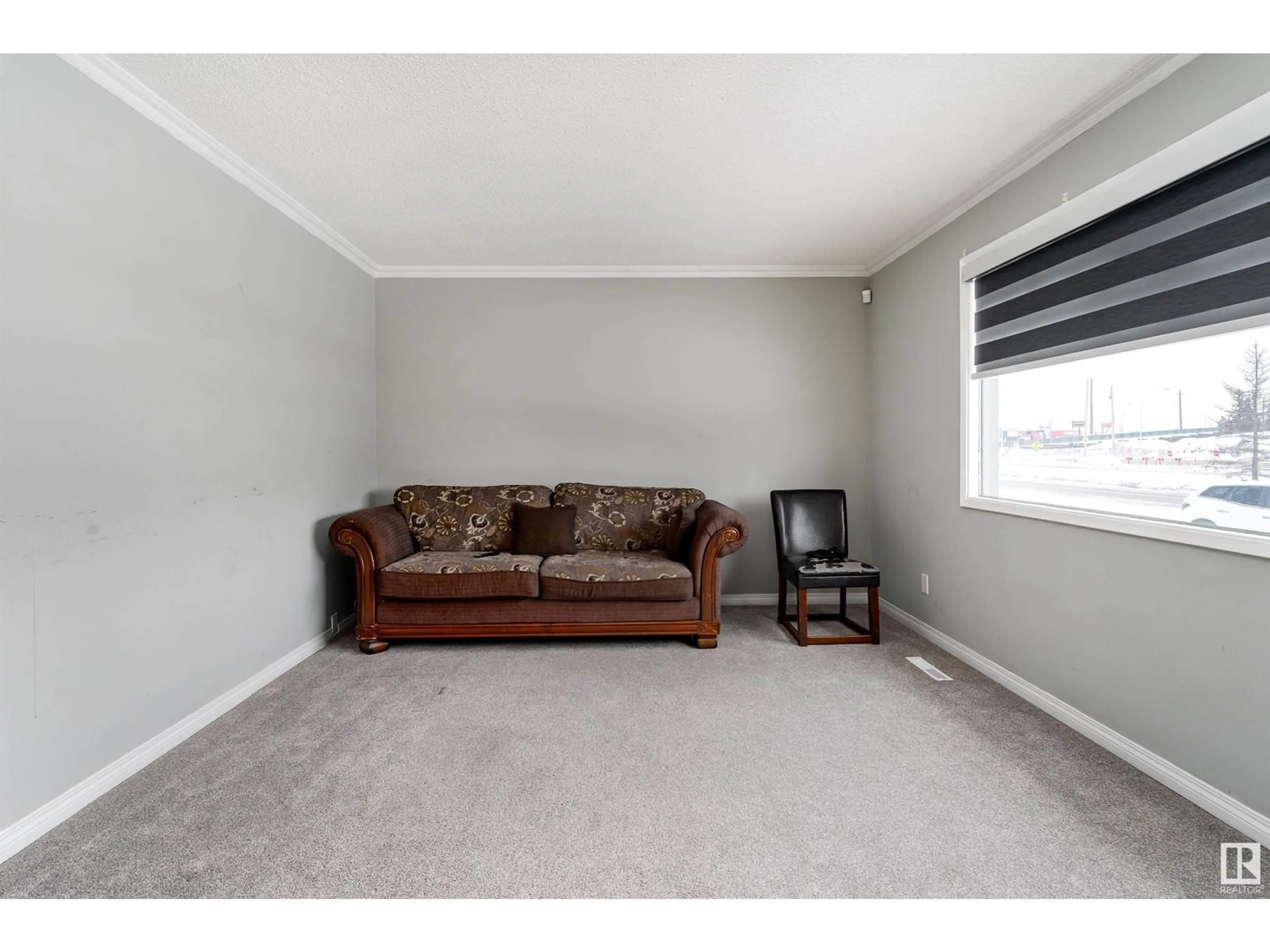 Living room with furniture, carpet floor for 5208 90 AV NW, Edmonton Alberta T6B0N9