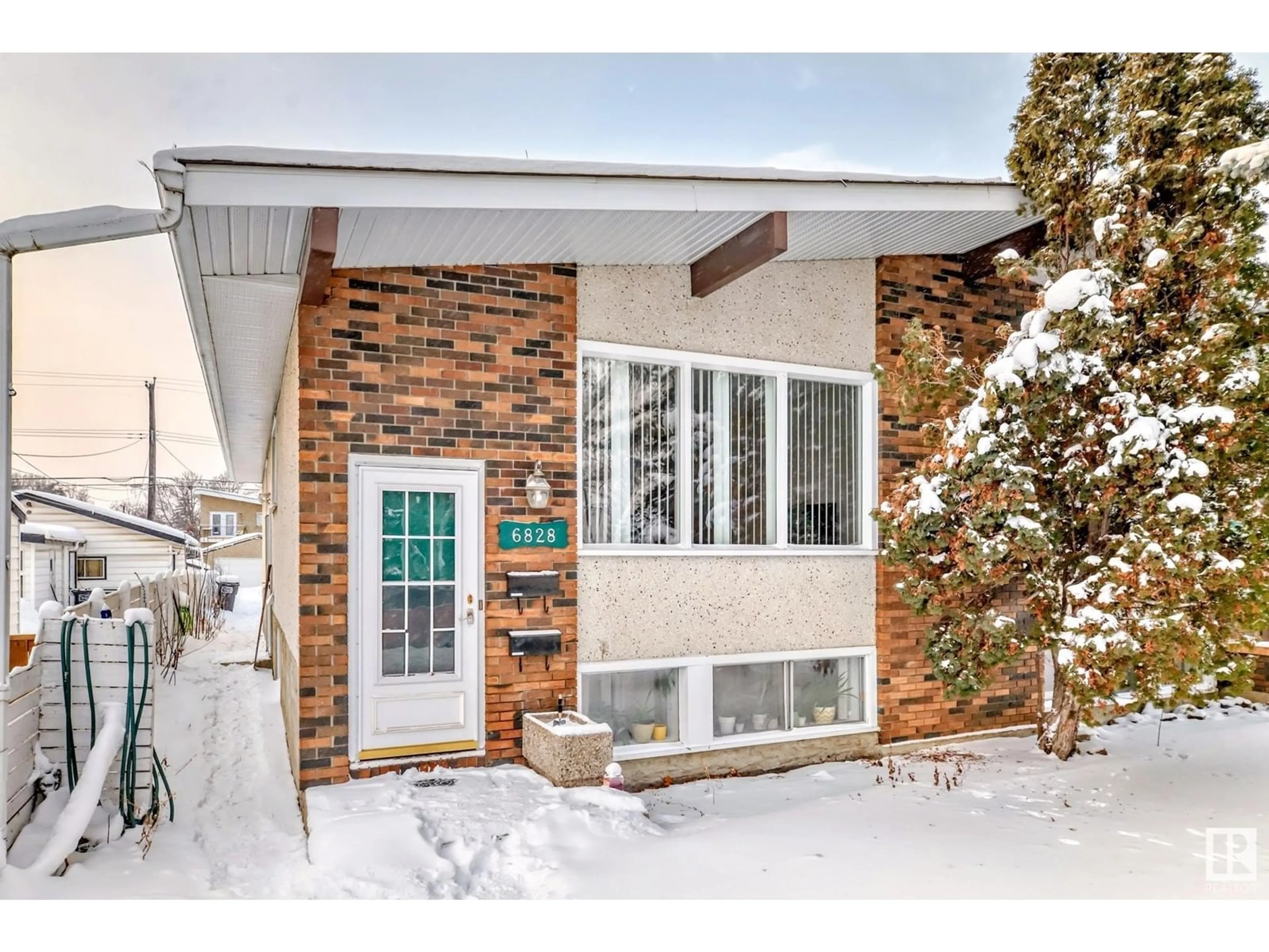 Home with brick exterior material, street for 6828 6830 105A ST NW, Edmonton Alberta T6H2R2