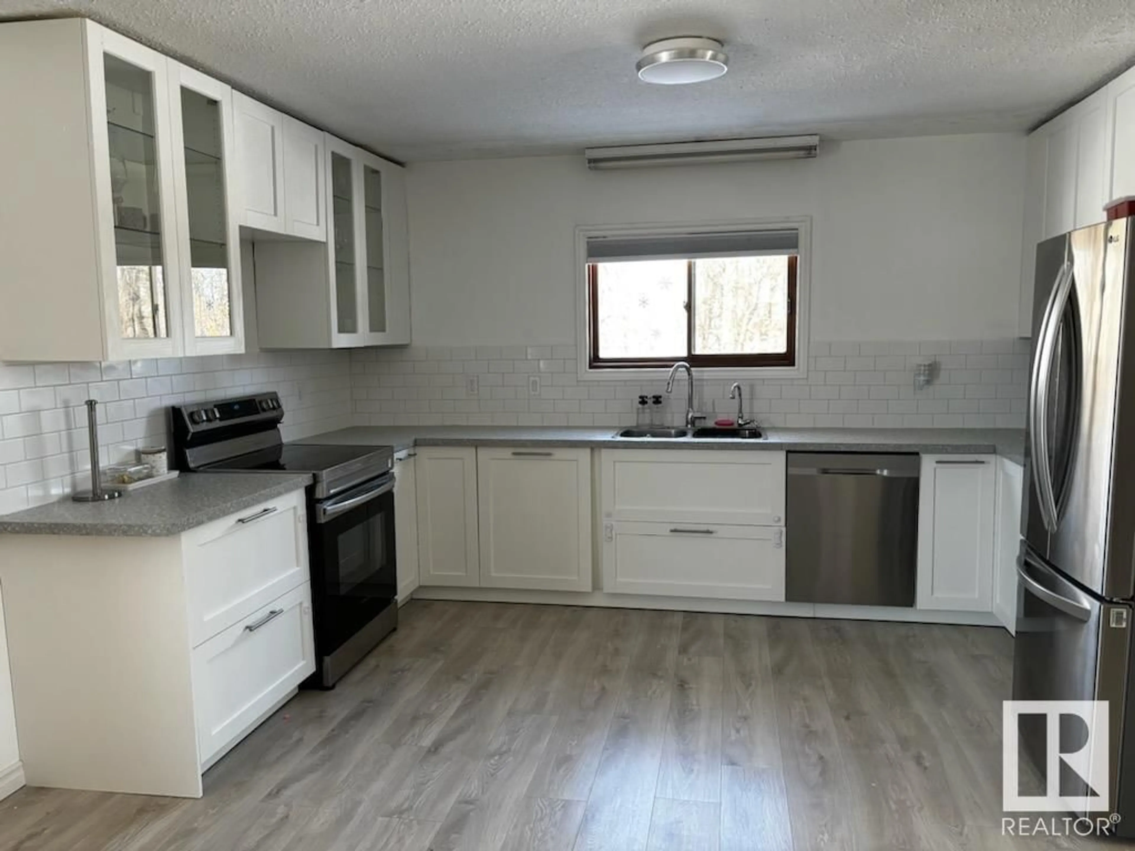 Standard kitchen, wood/laminate floor for 61522 HWY 2, Rural Westlock County Alberta T0G2E0