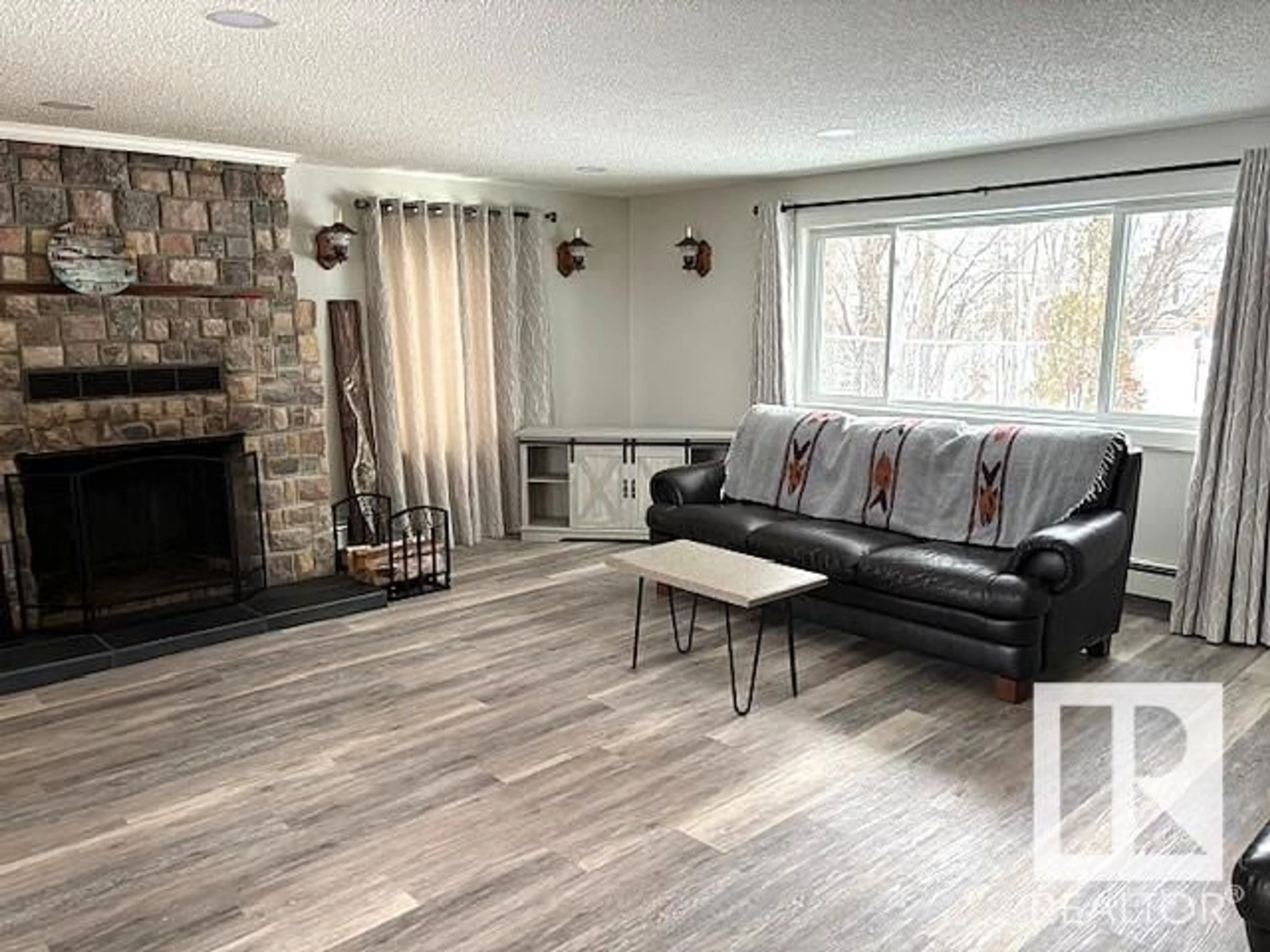 Living room with furniture, unknown for 5004 56, Rural Lac Ste. Anne County Alberta T0E0A0