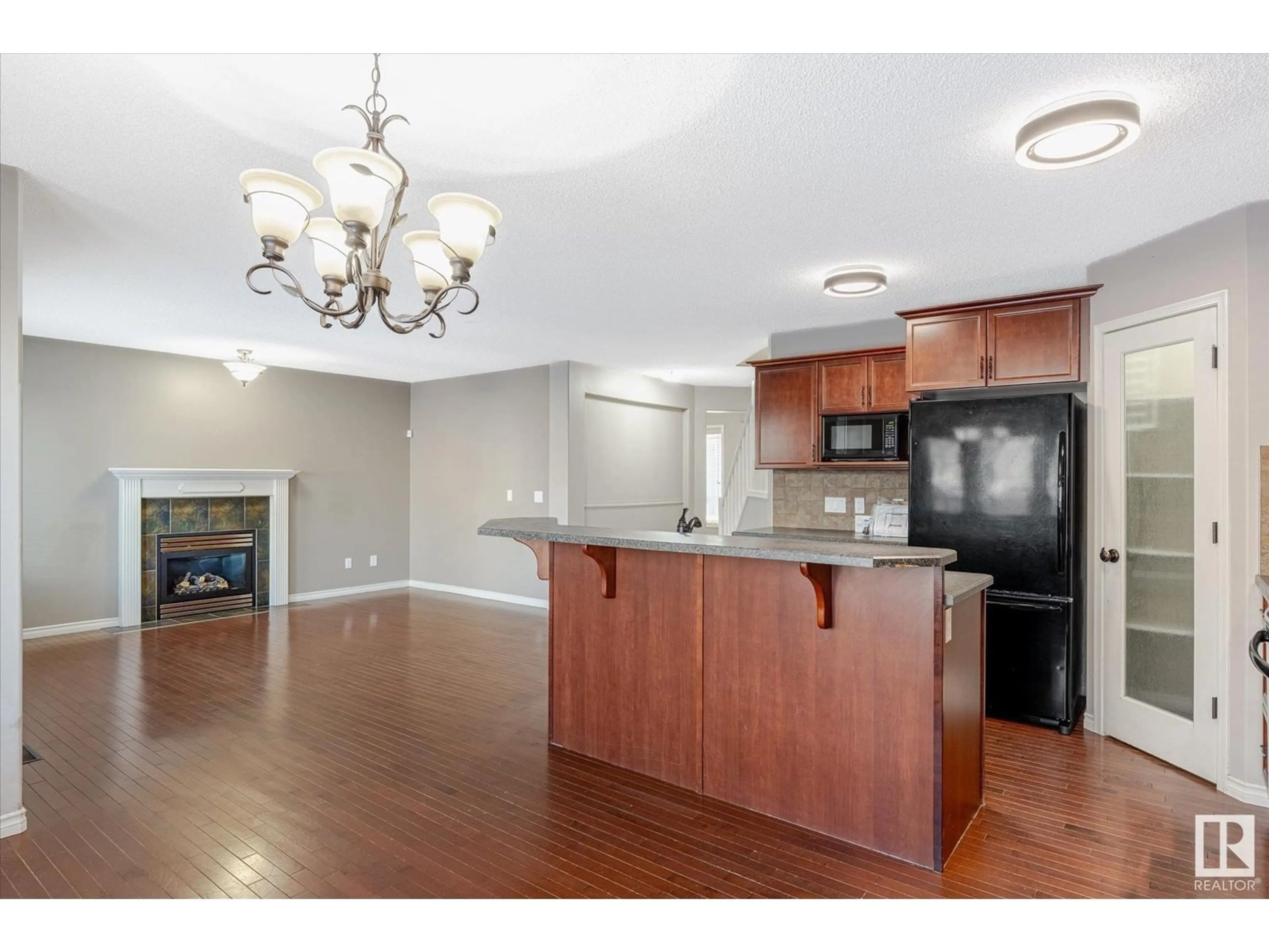 Open concept kitchen, wood/laminate floor for 1207 WESTERRA CR, Stony Plain Alberta T7Z0B2