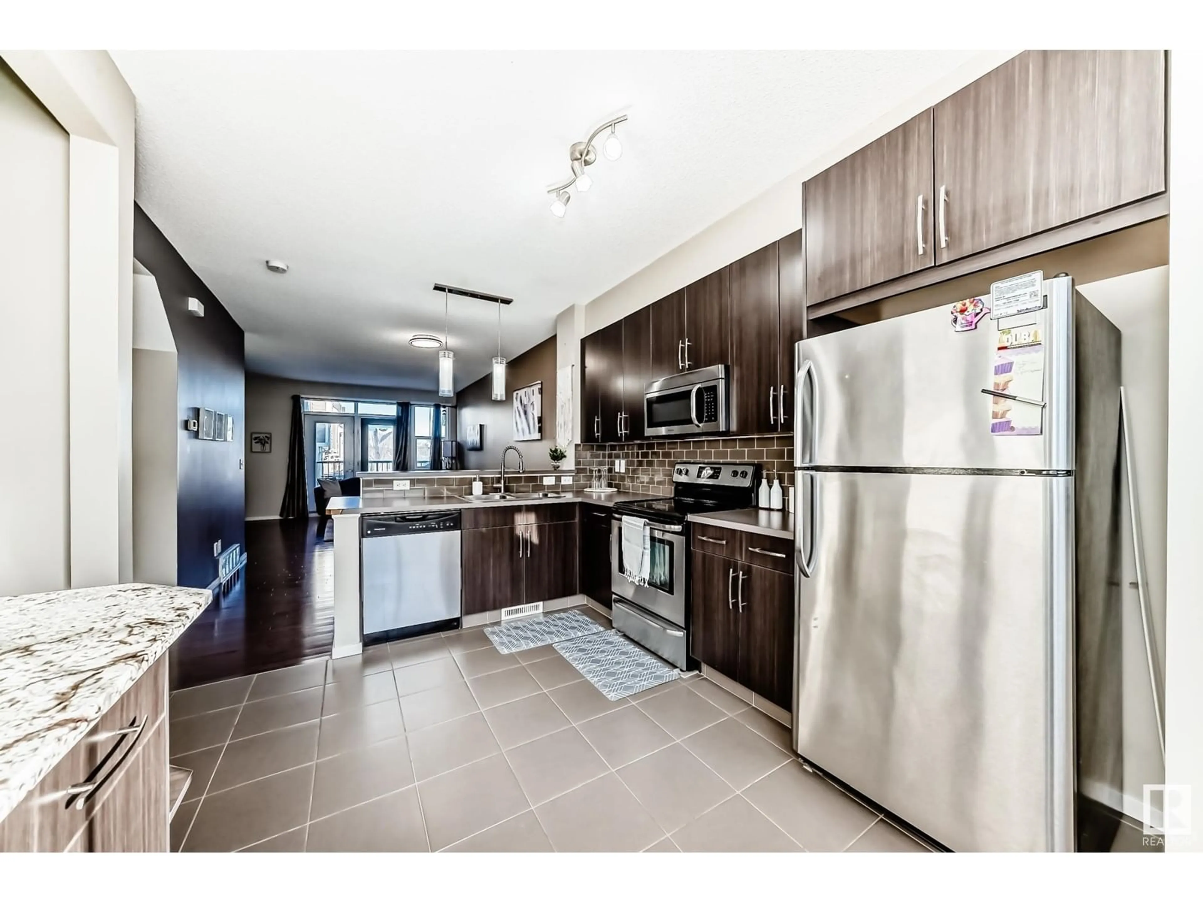 Open concept kitchen, ceramic/tile floor for #120 603 Watt BV SW, Edmonton Alberta T6X0P3