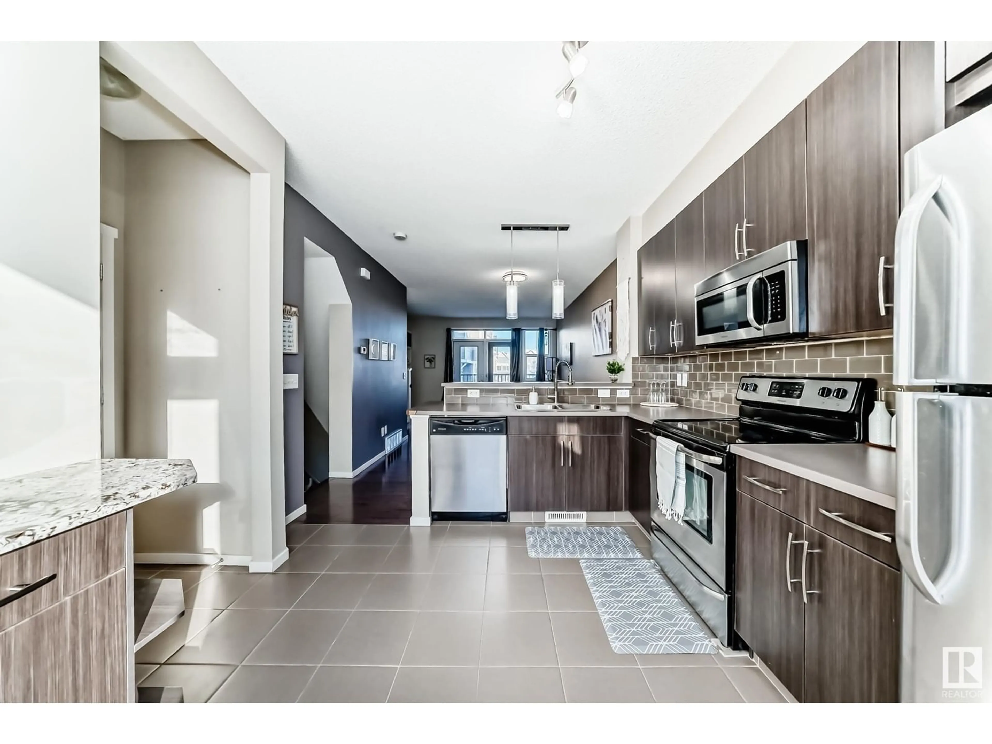 Open concept kitchen, ceramic/tile floor for #120 603 Watt BV SW, Edmonton Alberta T6X0P3