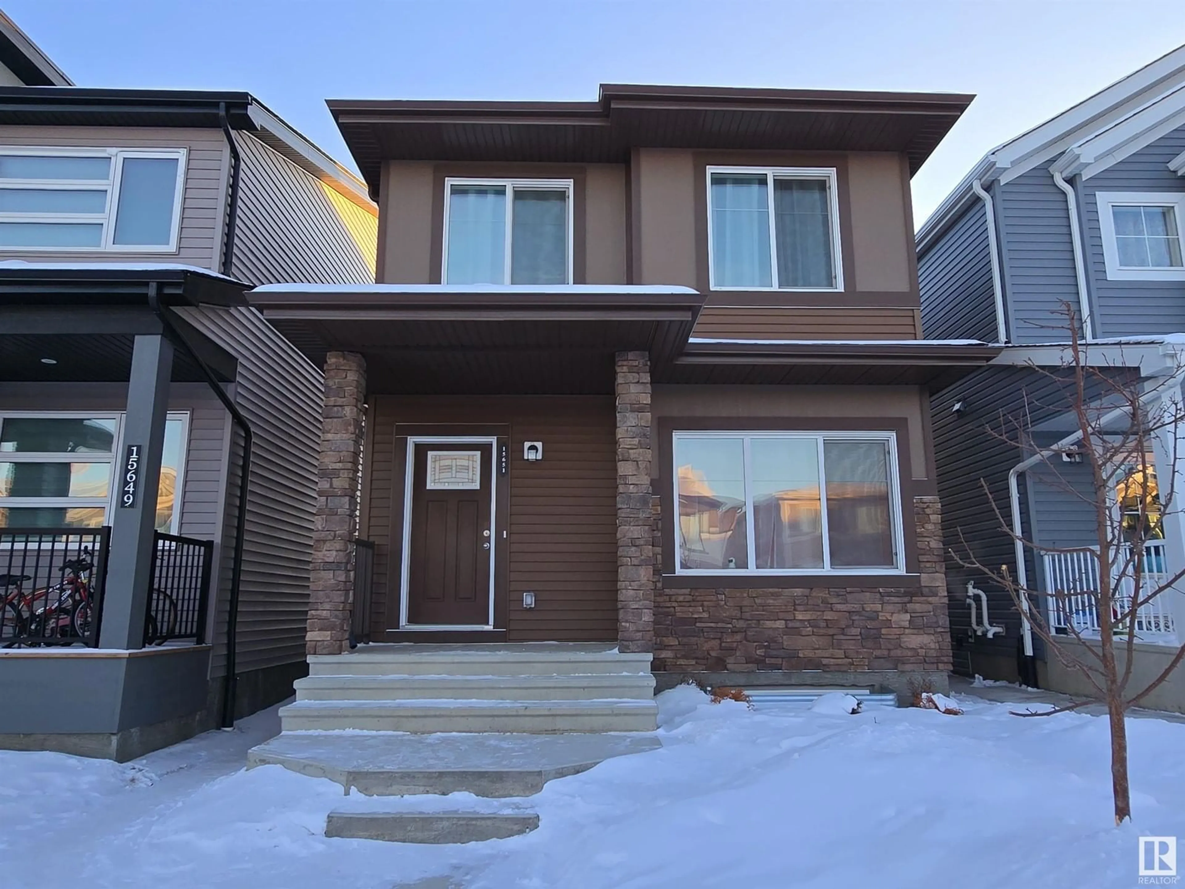 Home with brick exterior material, street for 15651 18 AV SW, Edmonton Alberta T6W5C2